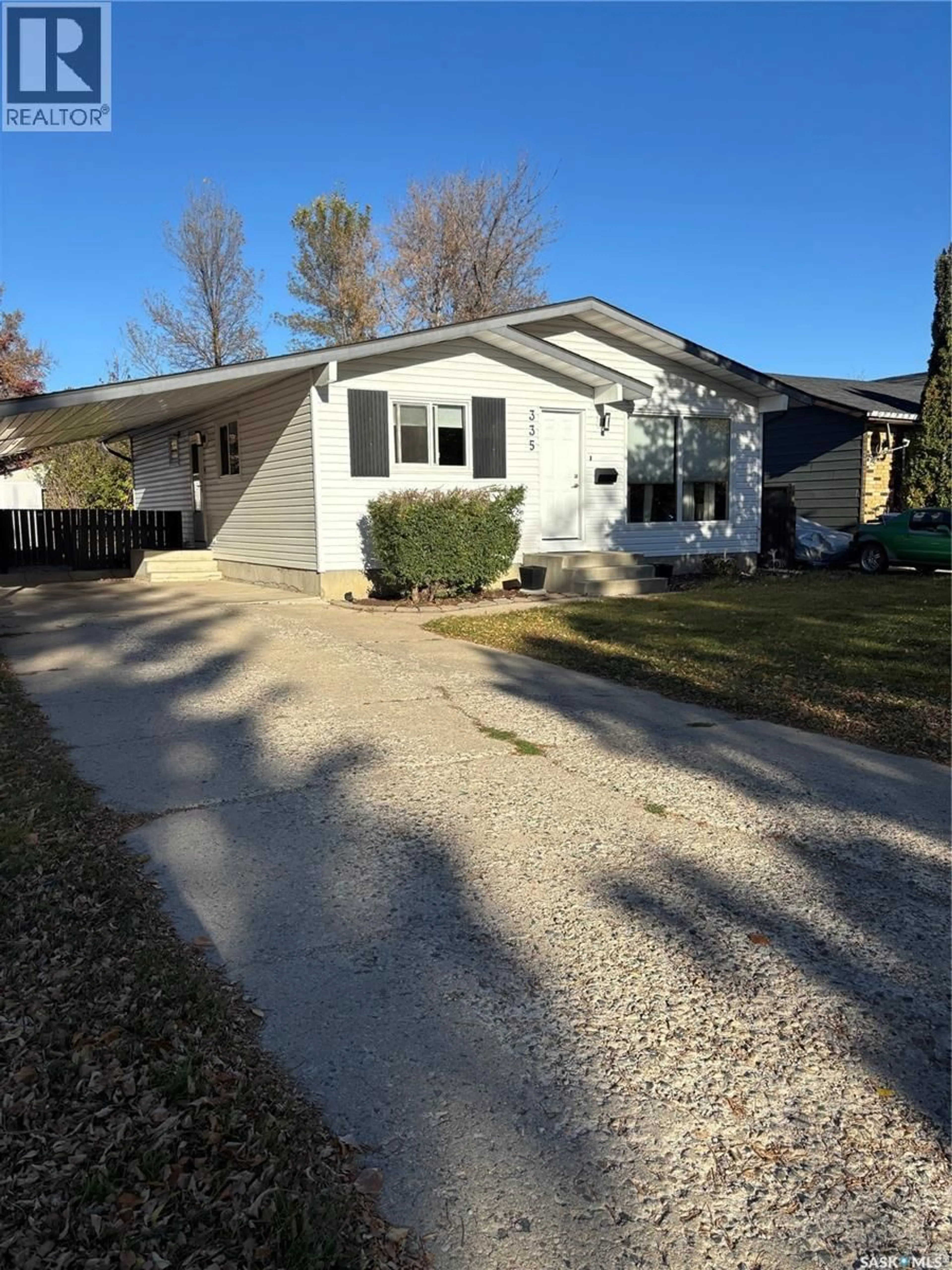 Home with vinyl exterior material, street for 335 AVONDALE ROAD, Saskatoon Saskatchewan S7H5B4