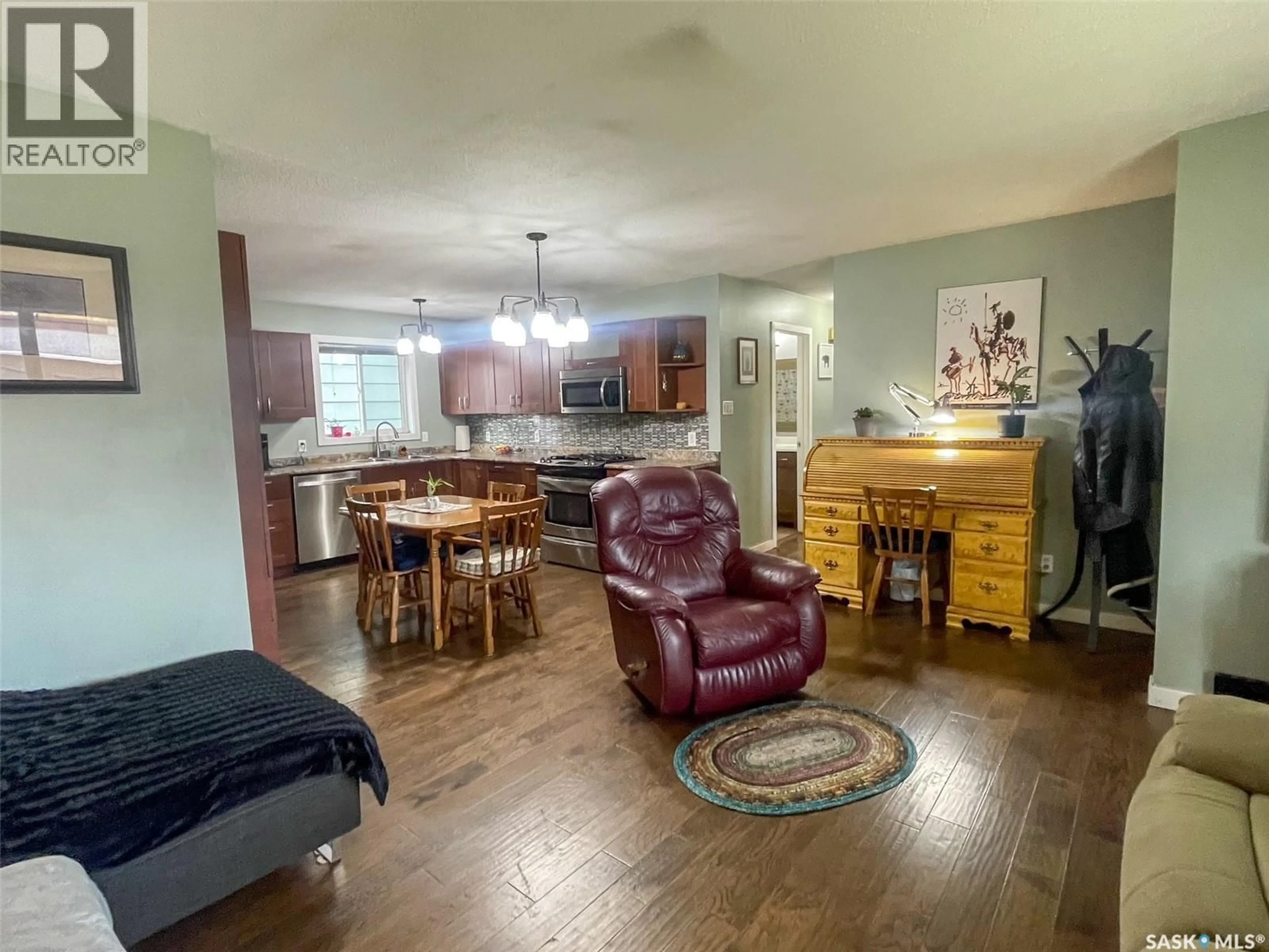 Living room with furniture, wood/laminate floor for 29 DUNFIELD CRESCENT, Meadow Lake Saskatchewan S9X1E3