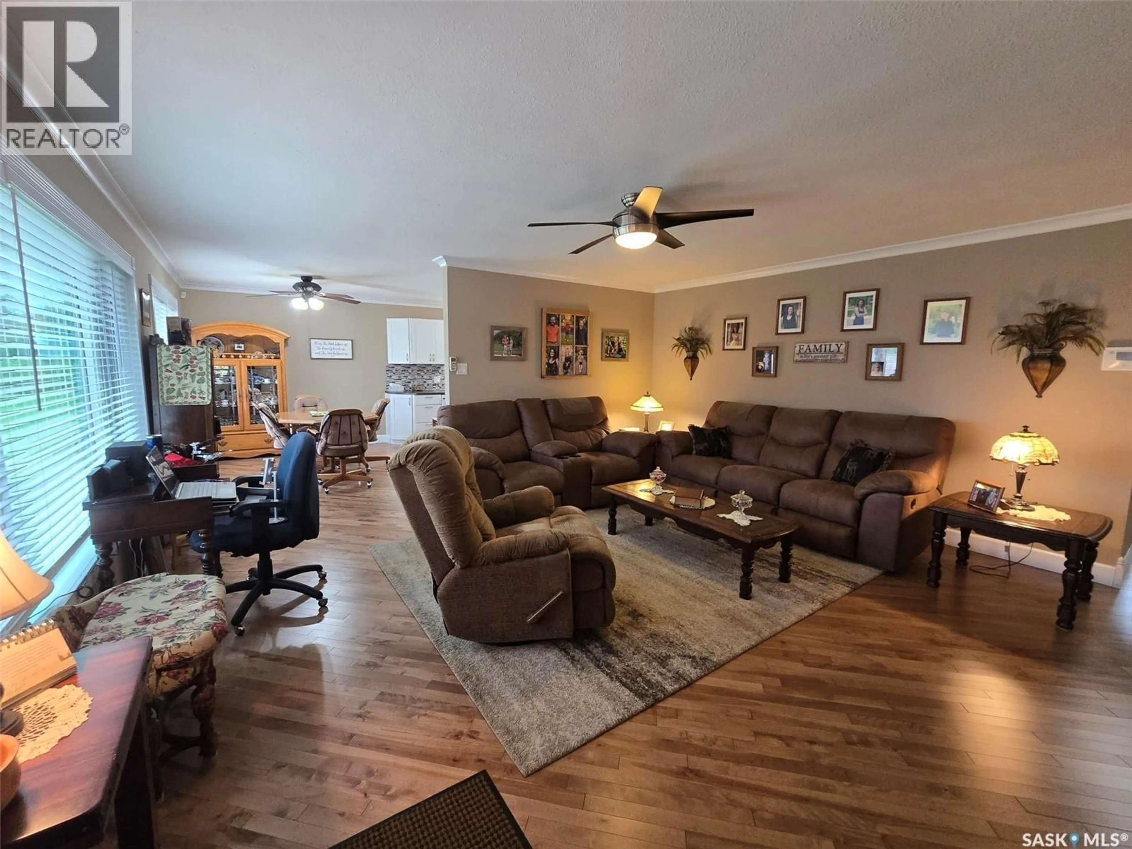 Living room with furniture, wood/laminate floor for 718 STELLA STREET, Grenfell Saskatchewan S0G2B0