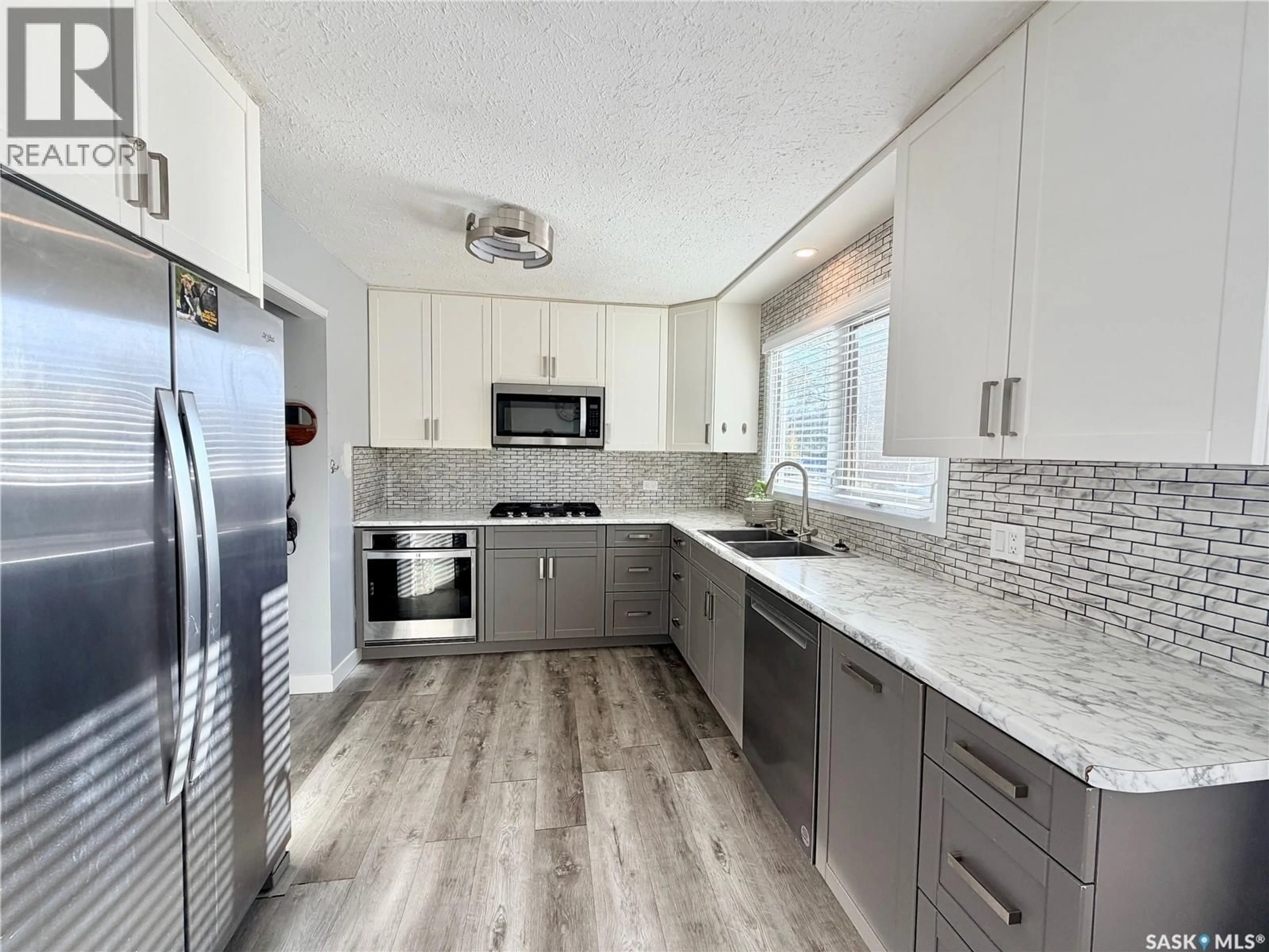 Contemporary kitchen, ceramic/tile floor for 9019 ABBOTT AVENUE, North Battleford Saskatchewan S9A3E8