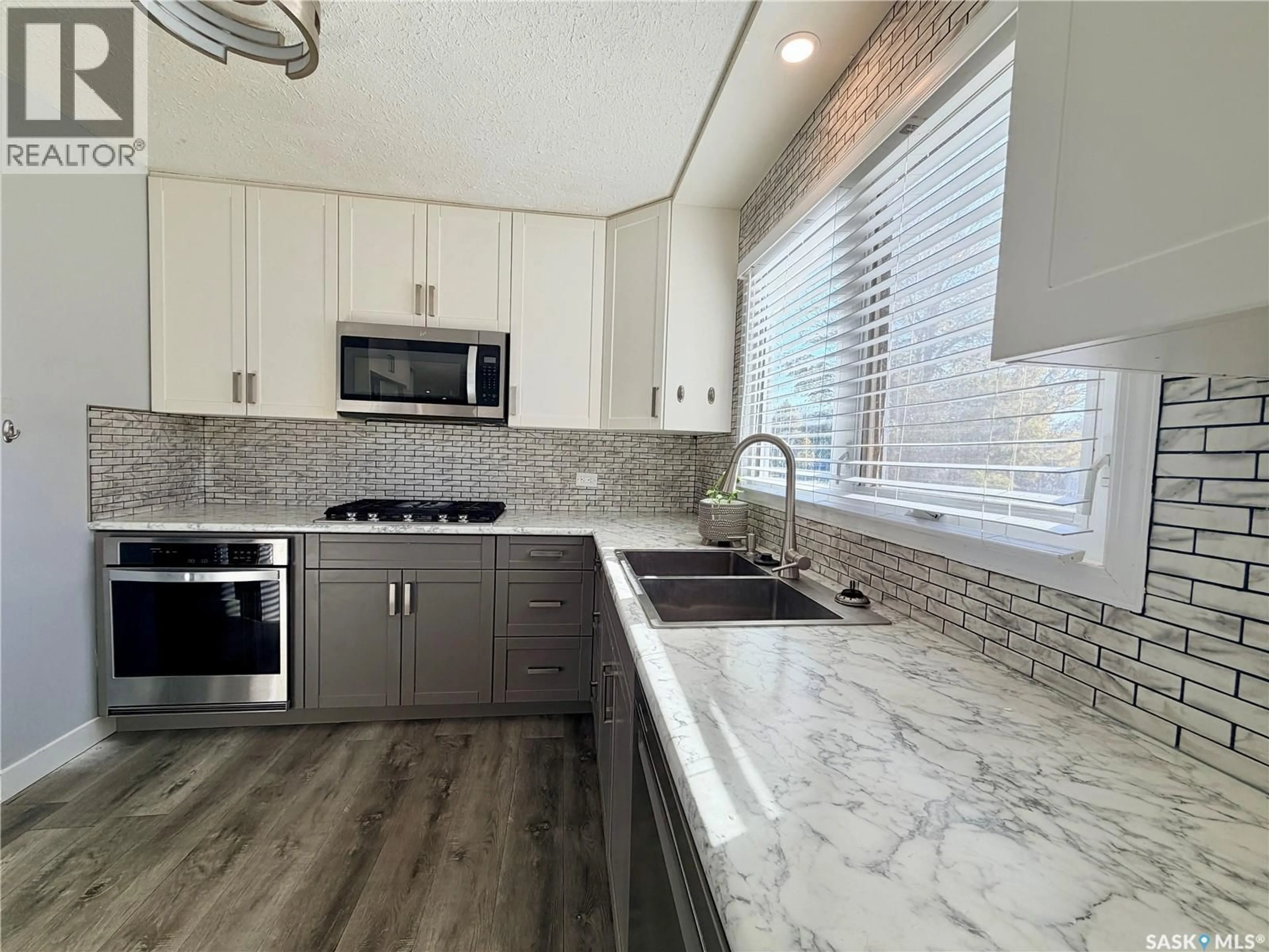 Contemporary kitchen, ceramic/tile floor for 9019 ABBOTT AVENUE, North Battleford Saskatchewan S9A3E8