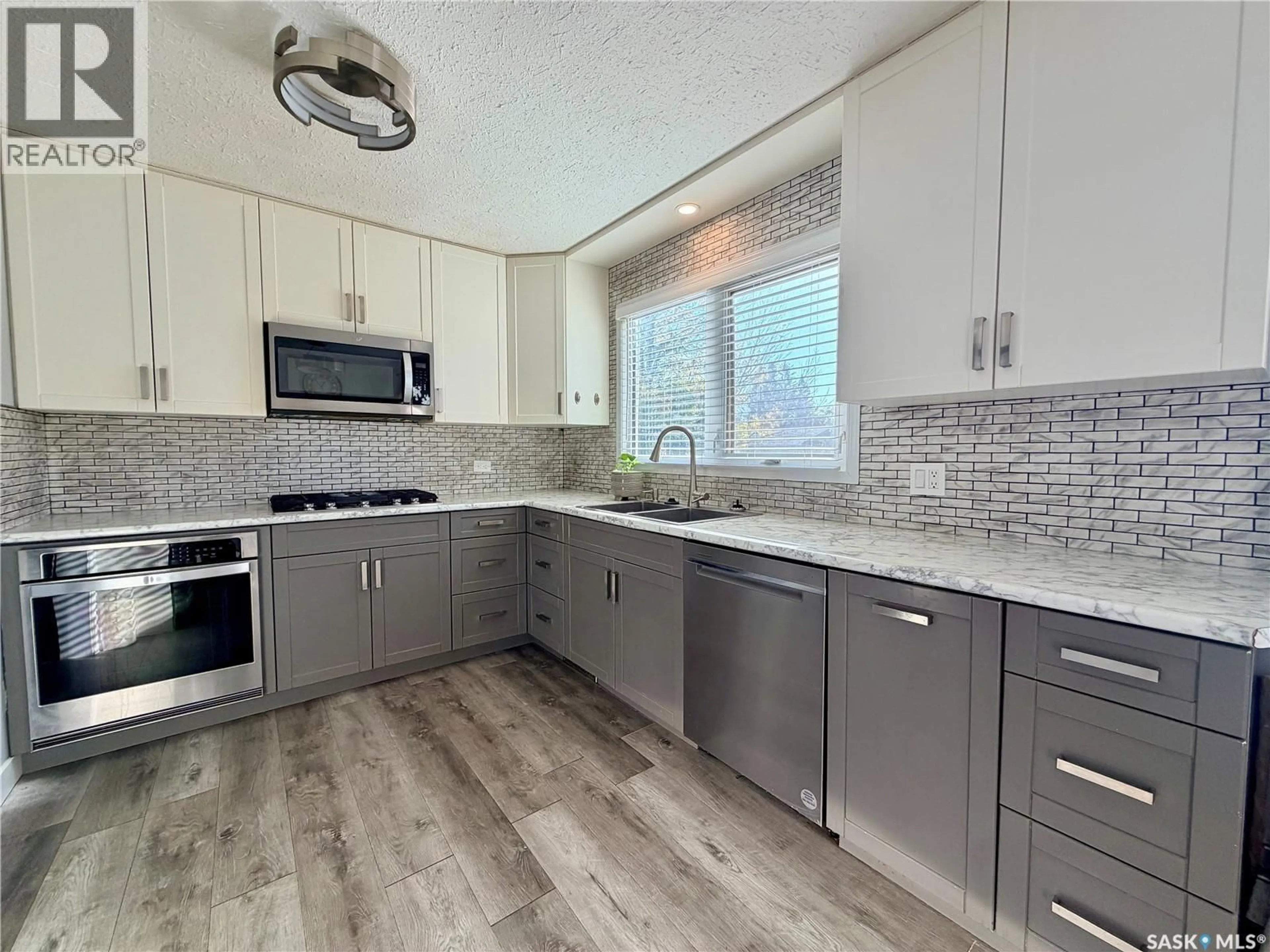 Open concept kitchen, ceramic/tile floor for 9019 ABBOTT AVENUE, North Battleford Saskatchewan S9A3E8