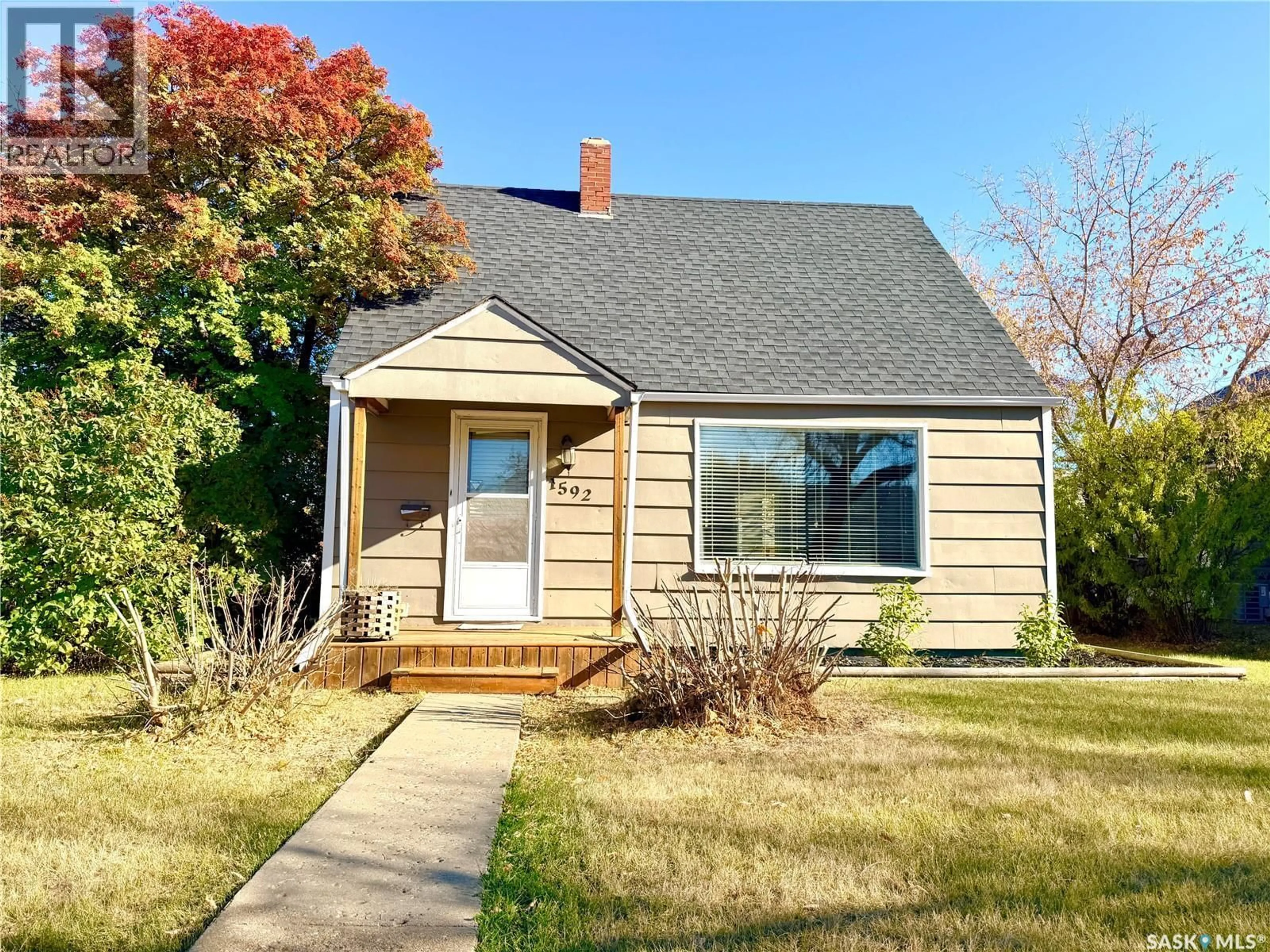 Home with vinyl exterior material, street for 1592 99TH STREET, North Battleford Saskatchewan S9A0R2