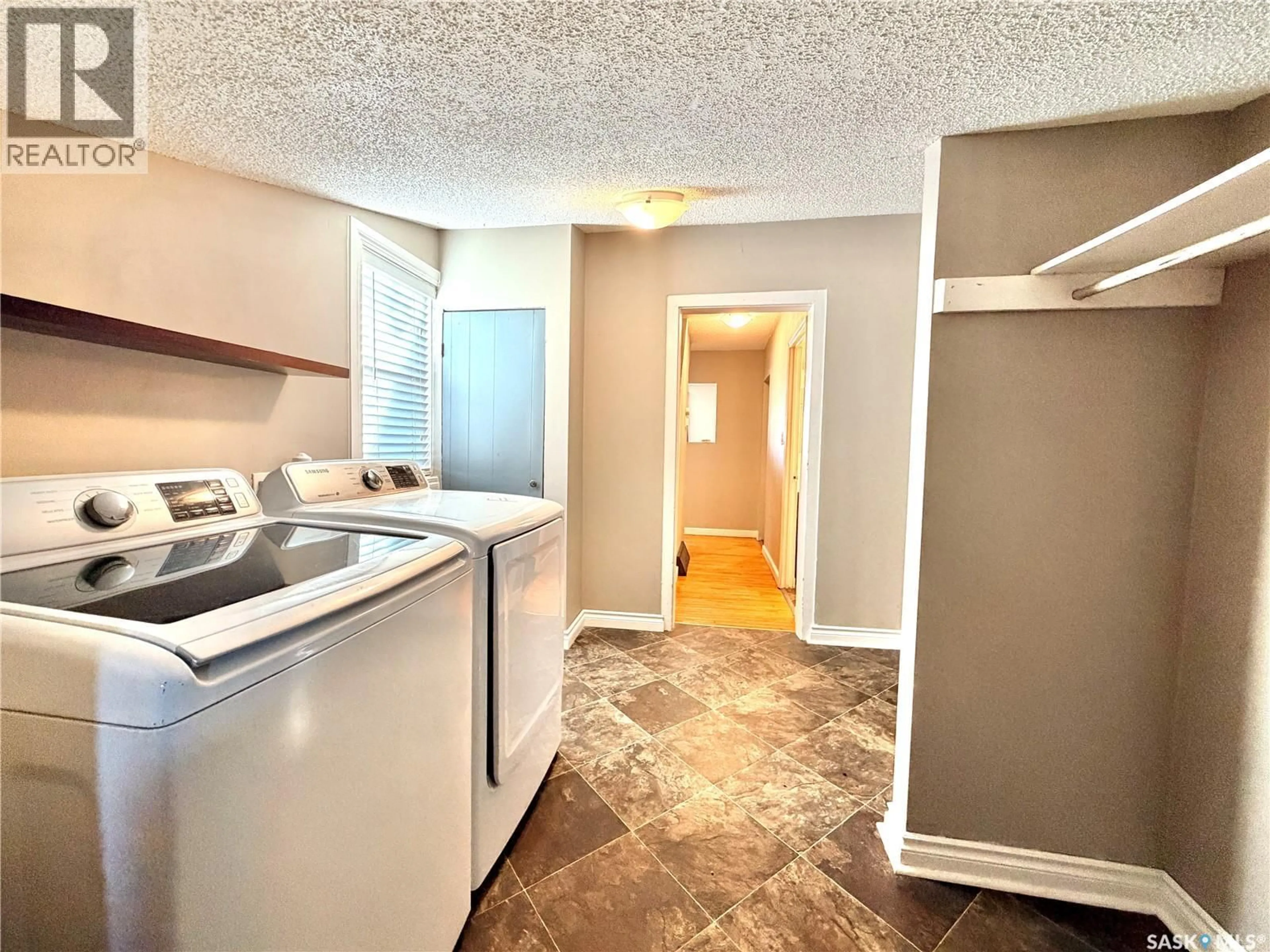 Kitchen with laundary machines, unknown for 1592 99TH STREET, North Battleford Saskatchewan S9A0R2