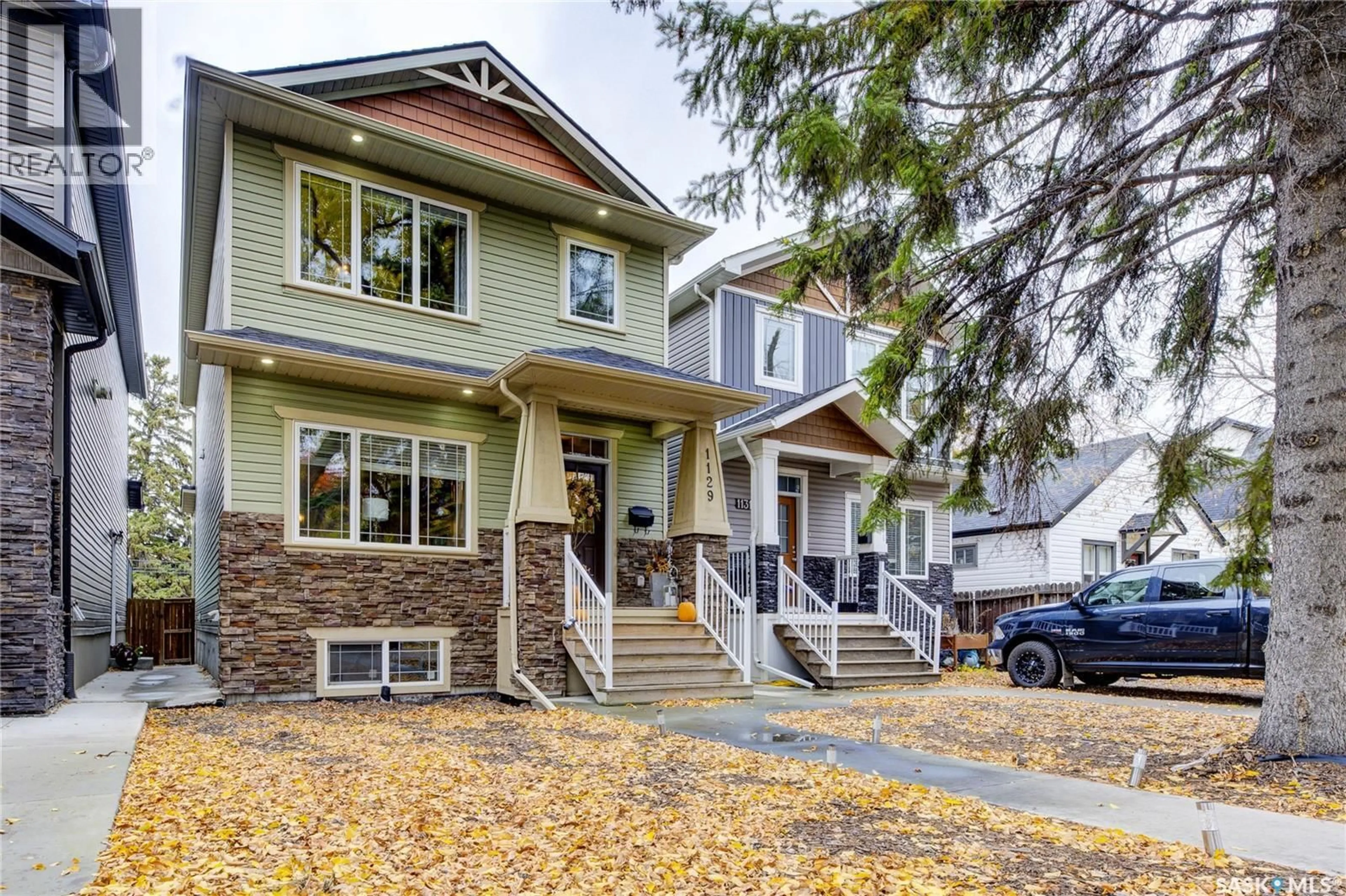 Home with vinyl exterior material, street for 1129 7TH STREET, Saskatoon Saskatchewan S7H0Y9