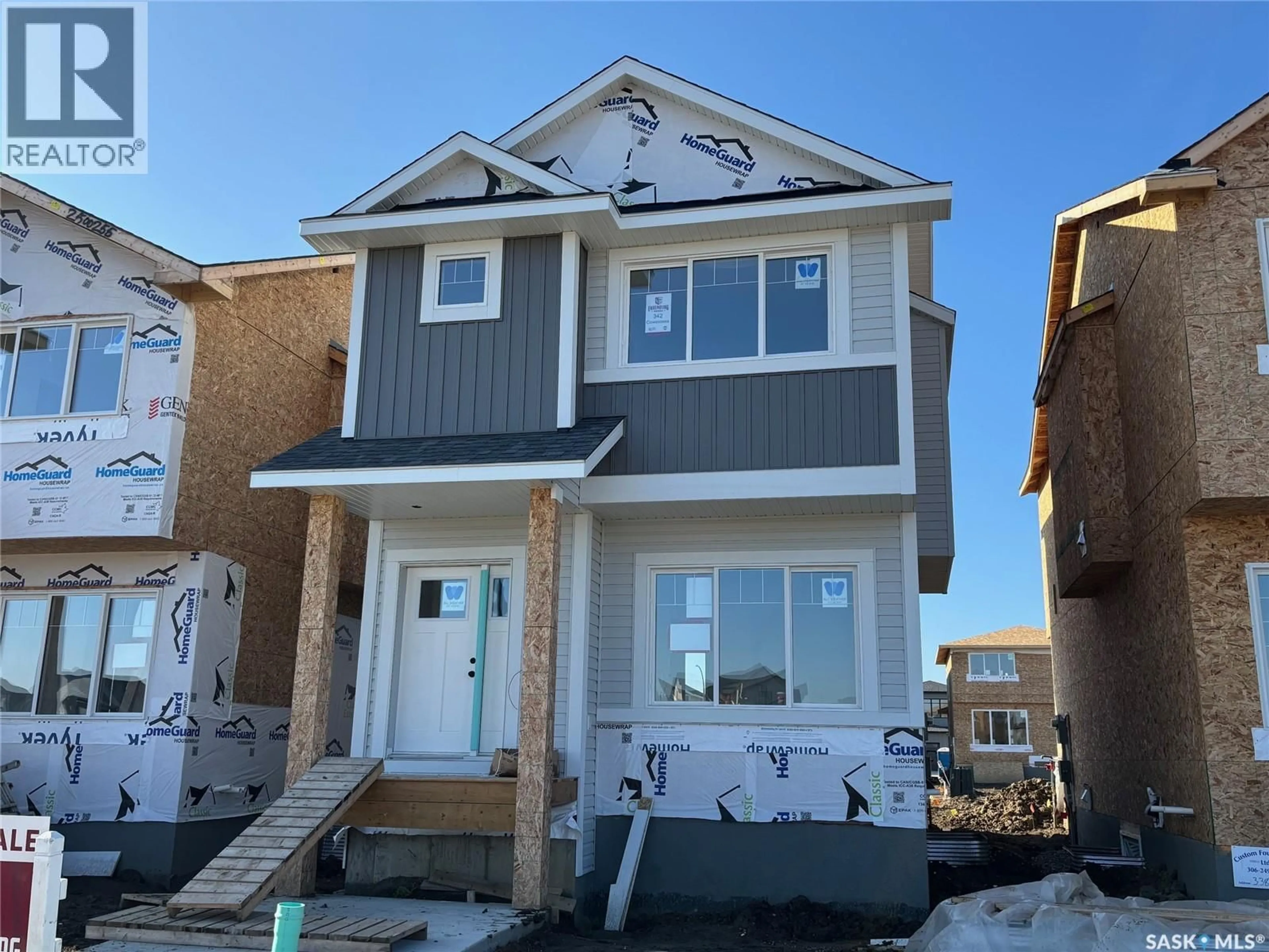 Home with vinyl exterior material, street for 342 COWESSESS ROAD, Saskatoon Saskatchewan S7V1Y4
