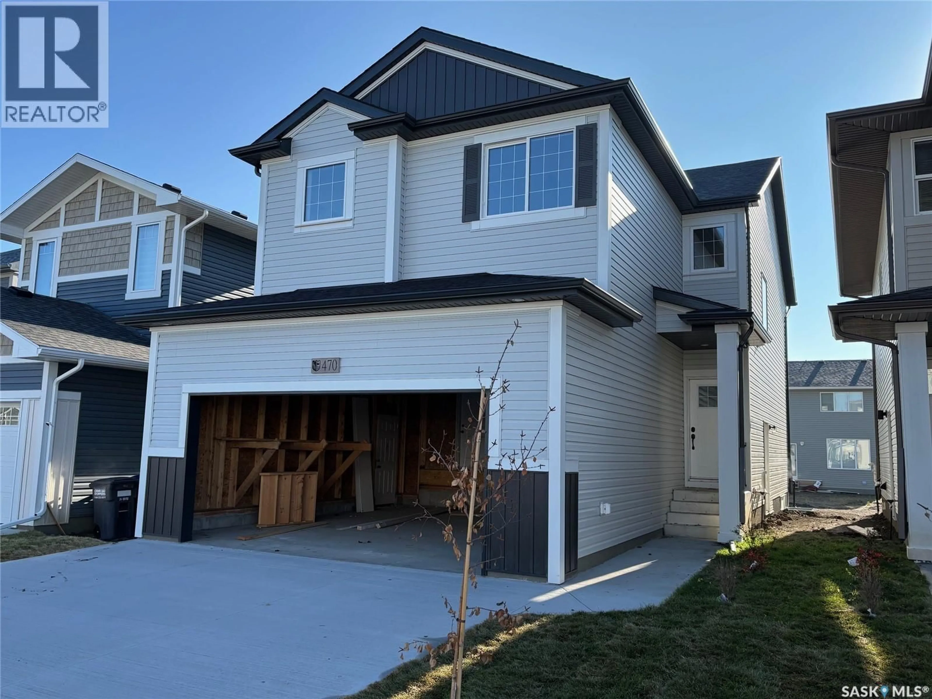 Home with vinyl exterior material, street for 470 DORAN CRESCENT, Saskatoon Saskatchewan S7V1W2