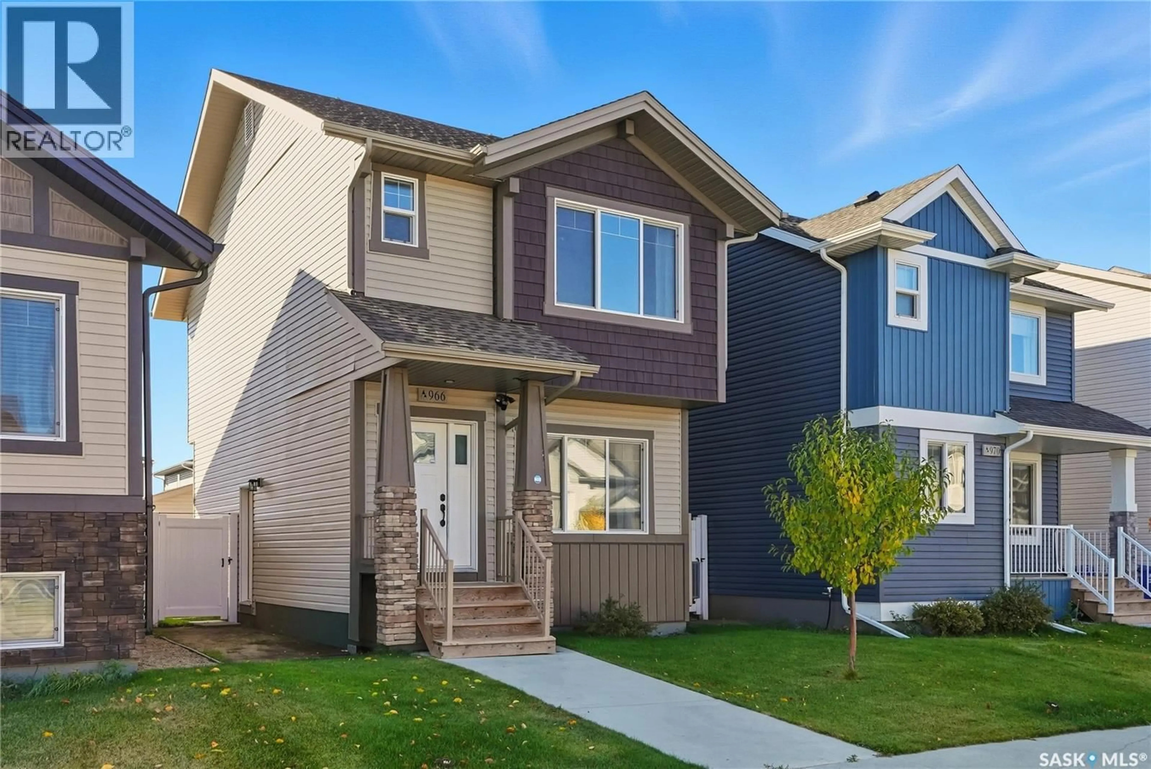 Home with vinyl exterior material, street for 966 MCFAULL MANOR, Saskatoon Saskatchewan S7V0S6