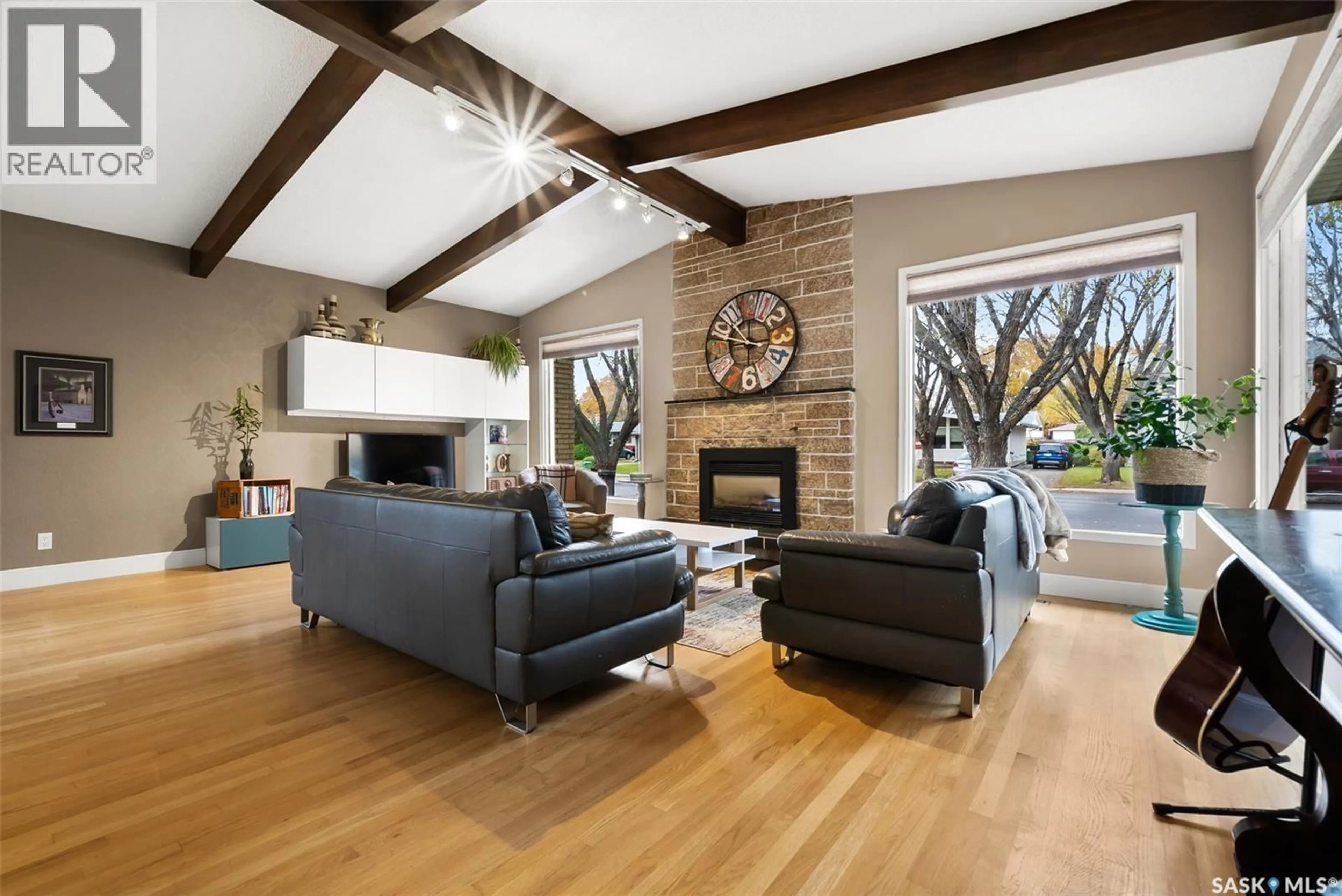 Living room with furniture, wood/laminate floor for 3851 MONTAGUE STREET, Regina Saskatchewan S4S3J6