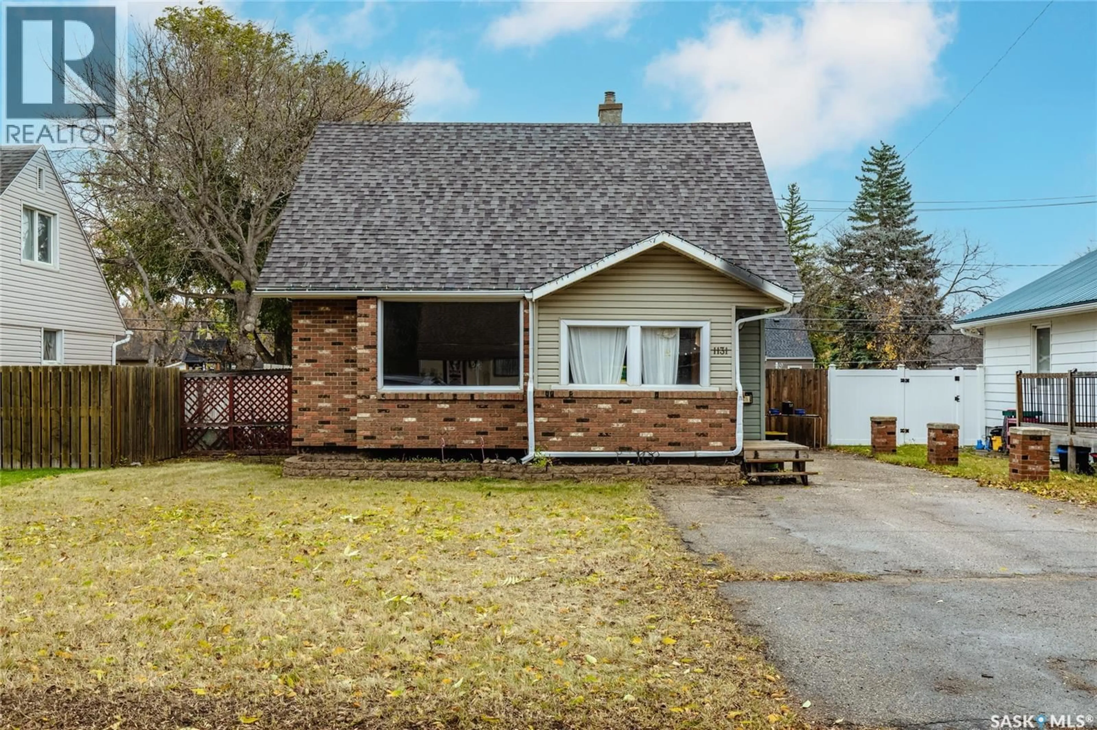 Home with vinyl exterior material, street for 1131 7TH AVENUE, Moose Jaw Saskatchewan S6H4C6