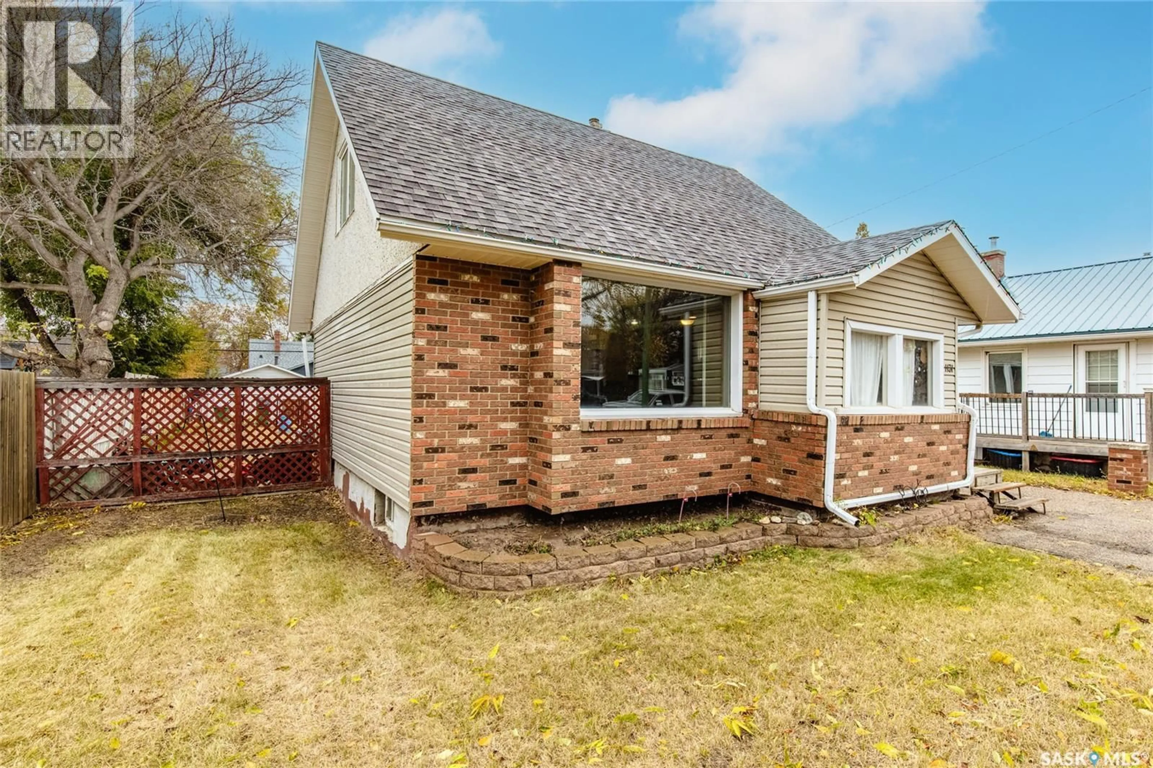 Home with brick exterior material, street for 1131 7TH AVENUE, Moose Jaw Saskatchewan S6H4C6
