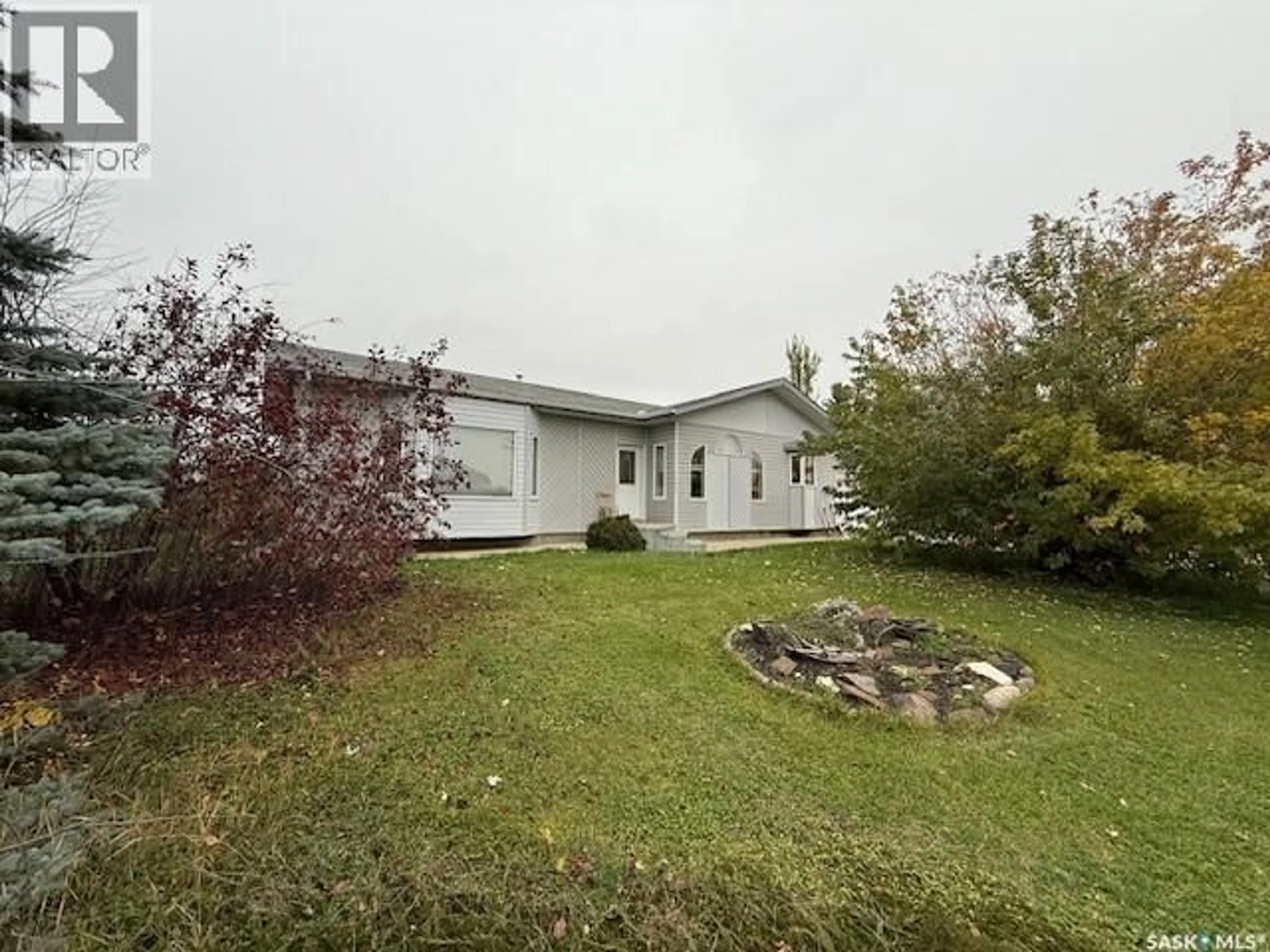 A pic from outside/outdoor area/front of a property/back of a property/a pic from drone, water/lake/river/ocean view for 60 BANKS CRESCENT, Kamsack Saskatchewan S0A1S0