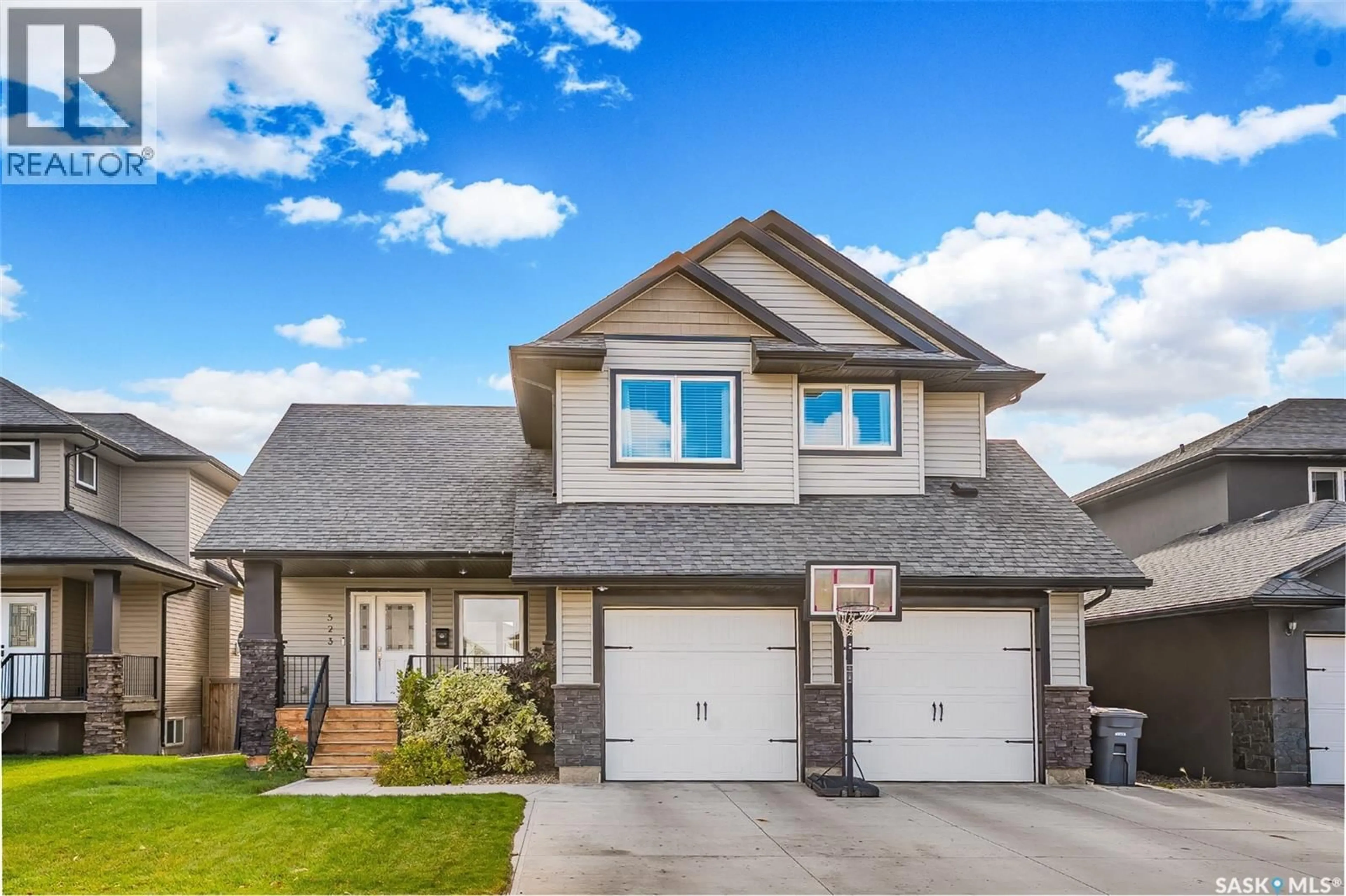 Home with vinyl exterior material, street for 523 REDWOOD DRIVE, Warman Saskatchewan S0K4S2