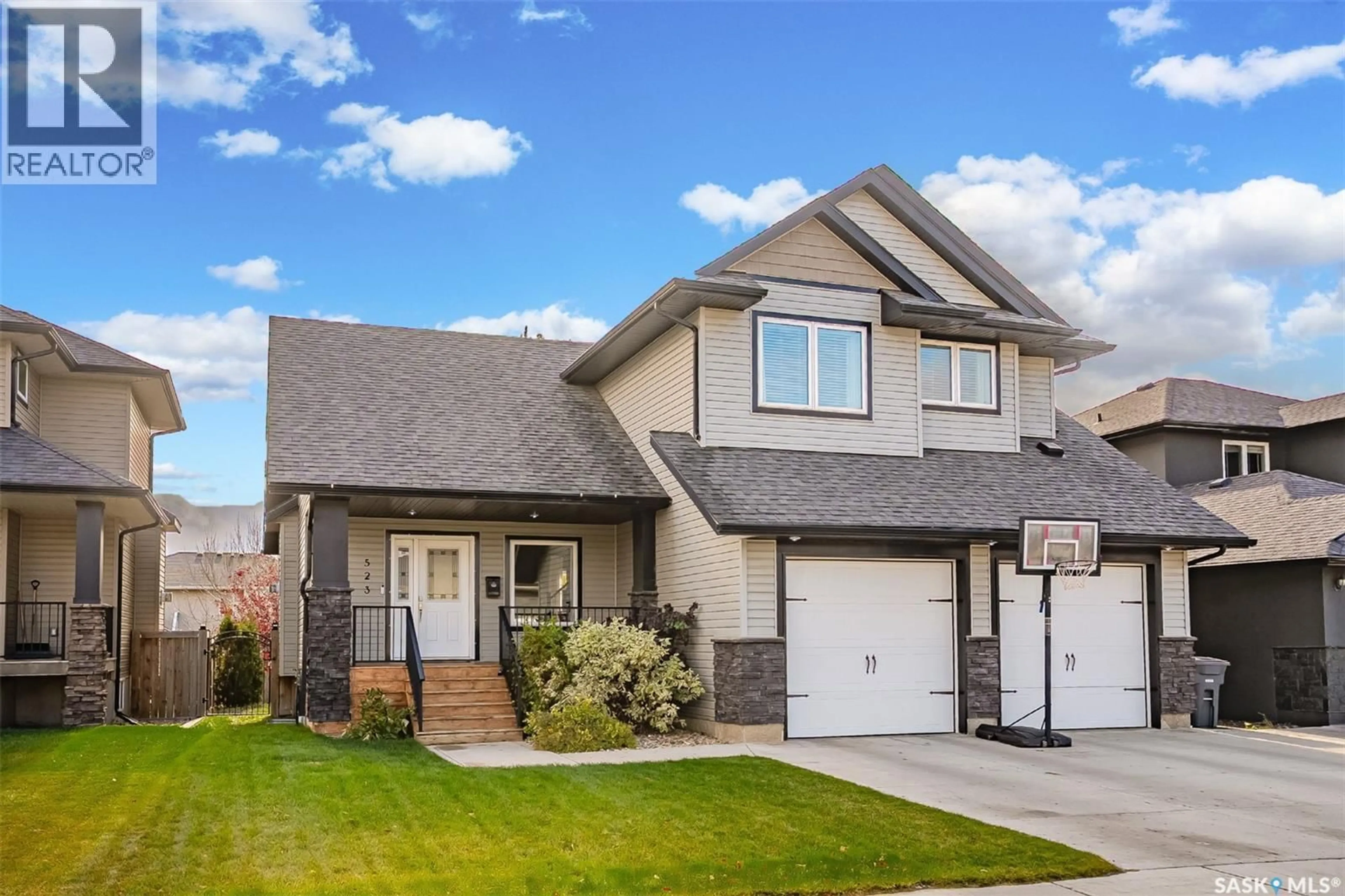 Home with vinyl exterior material, street for 523 REDWOOD DRIVE, Warman Saskatchewan S0K4S2