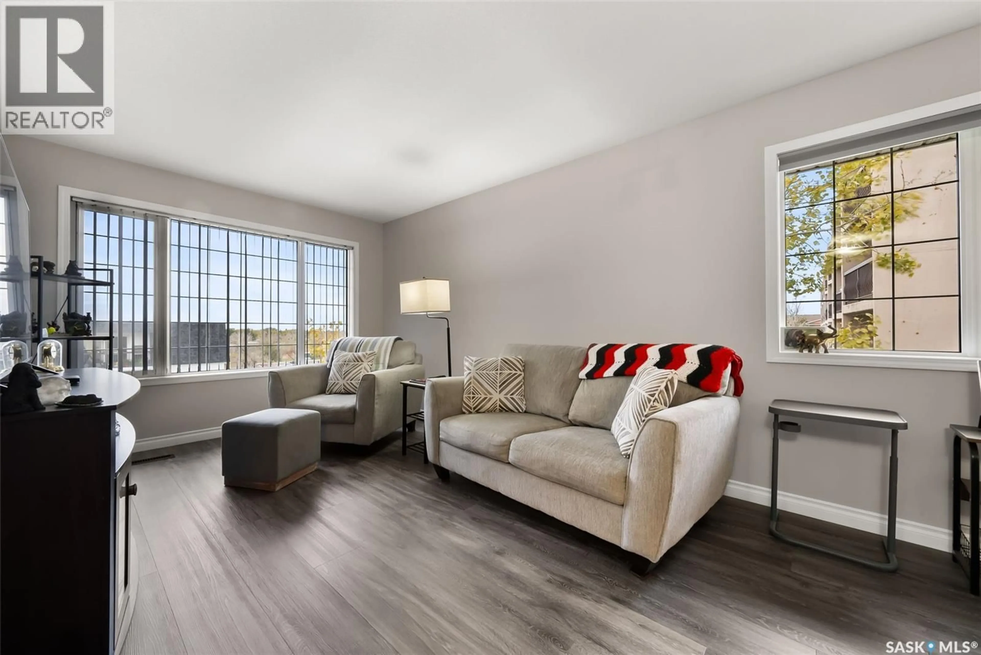 Living room with furniture, wood/laminate floor for 404 28 KLEISINGER CRESCENT, Regina Saskatchewan S4R8T8