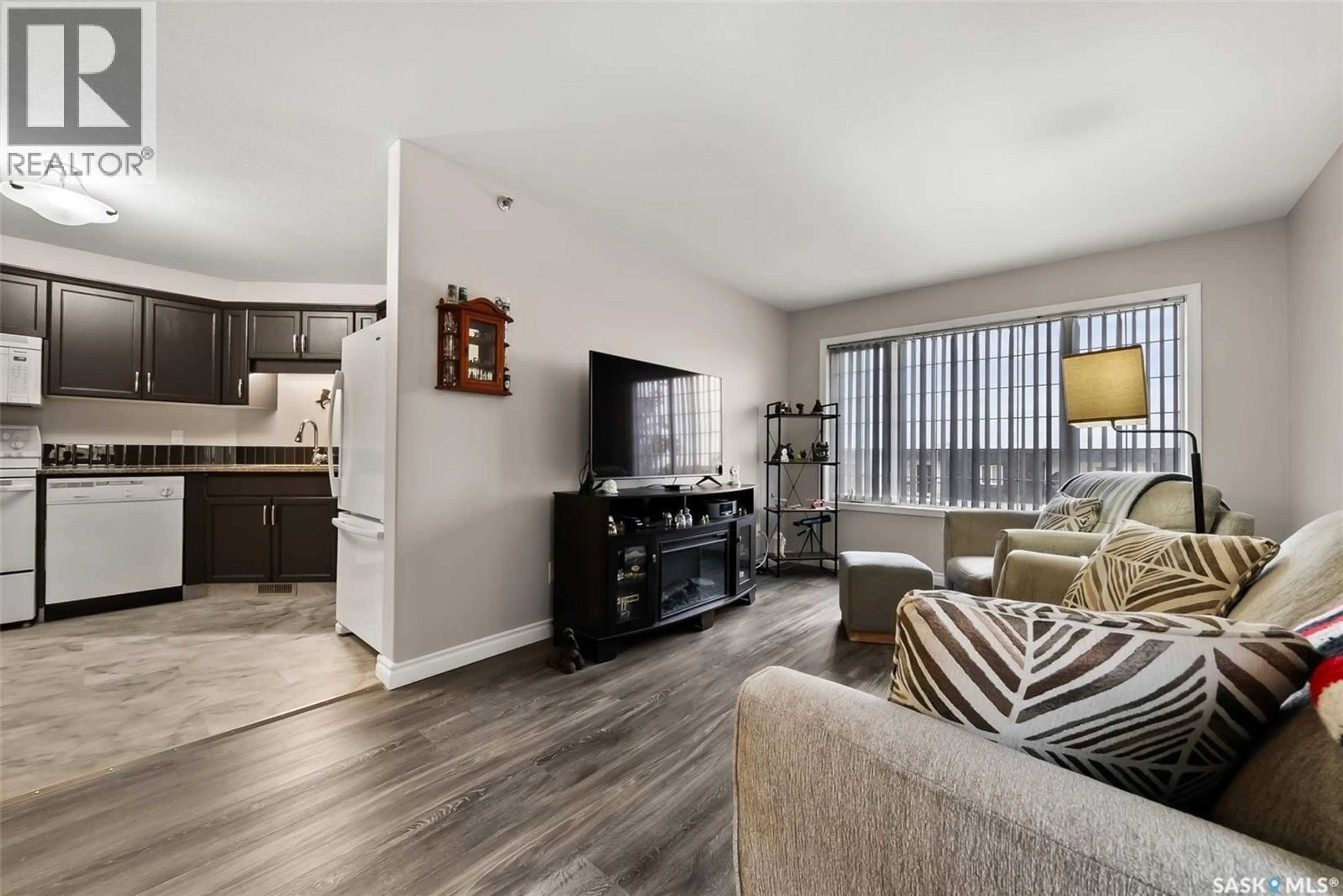 Living room with furniture, wood/laminate floor for 404 28 KLEISINGER CRESCENT, Regina Saskatchewan S4R8T8