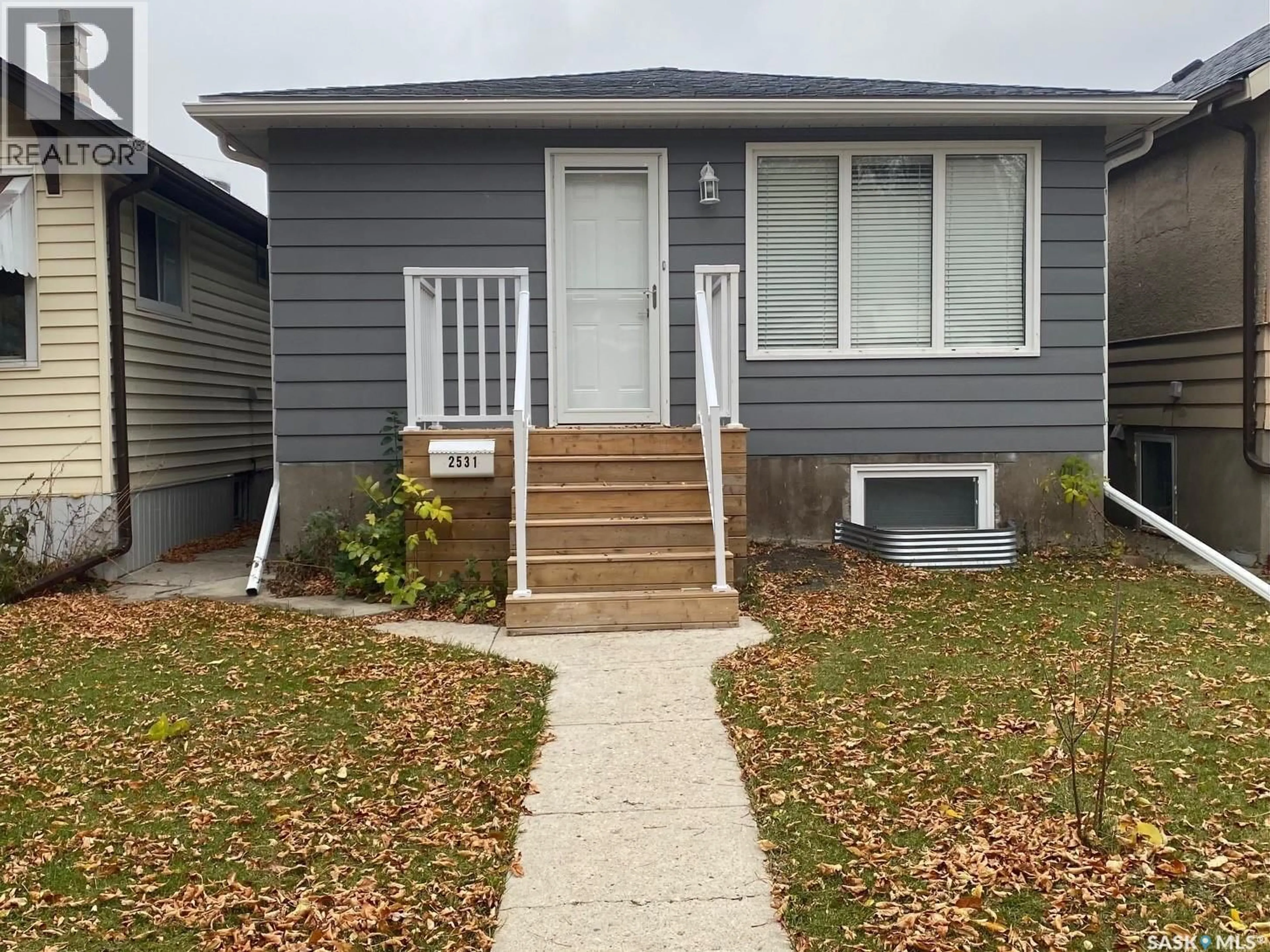 Home with vinyl exterior material, street for 2531 BRODER STREET, Regina Saskatchewan S4N3T4