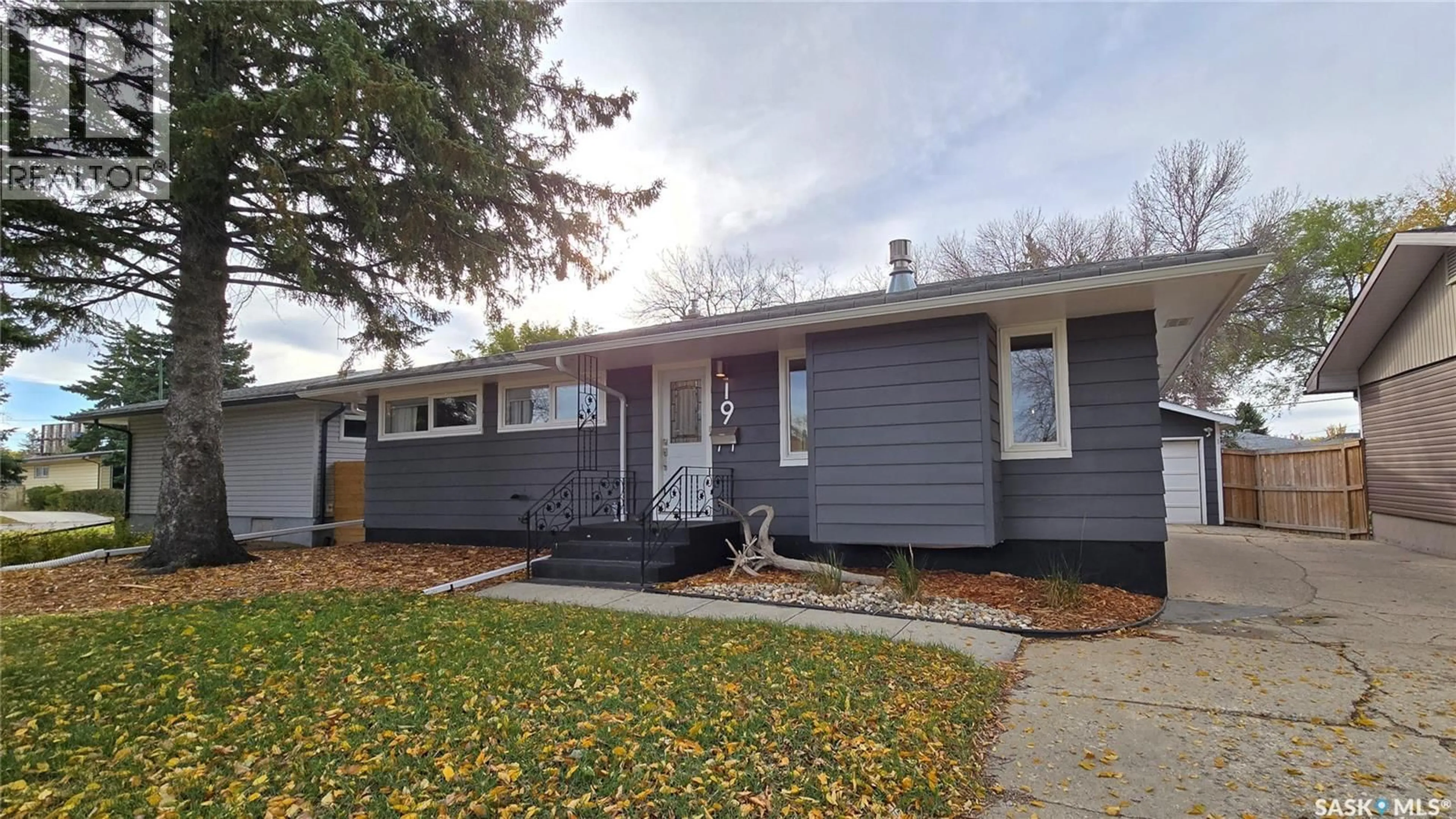 Home with vinyl exterior material, street for 19 DEMARCO DRIVE, Regina Saskatchewan S4T5W7