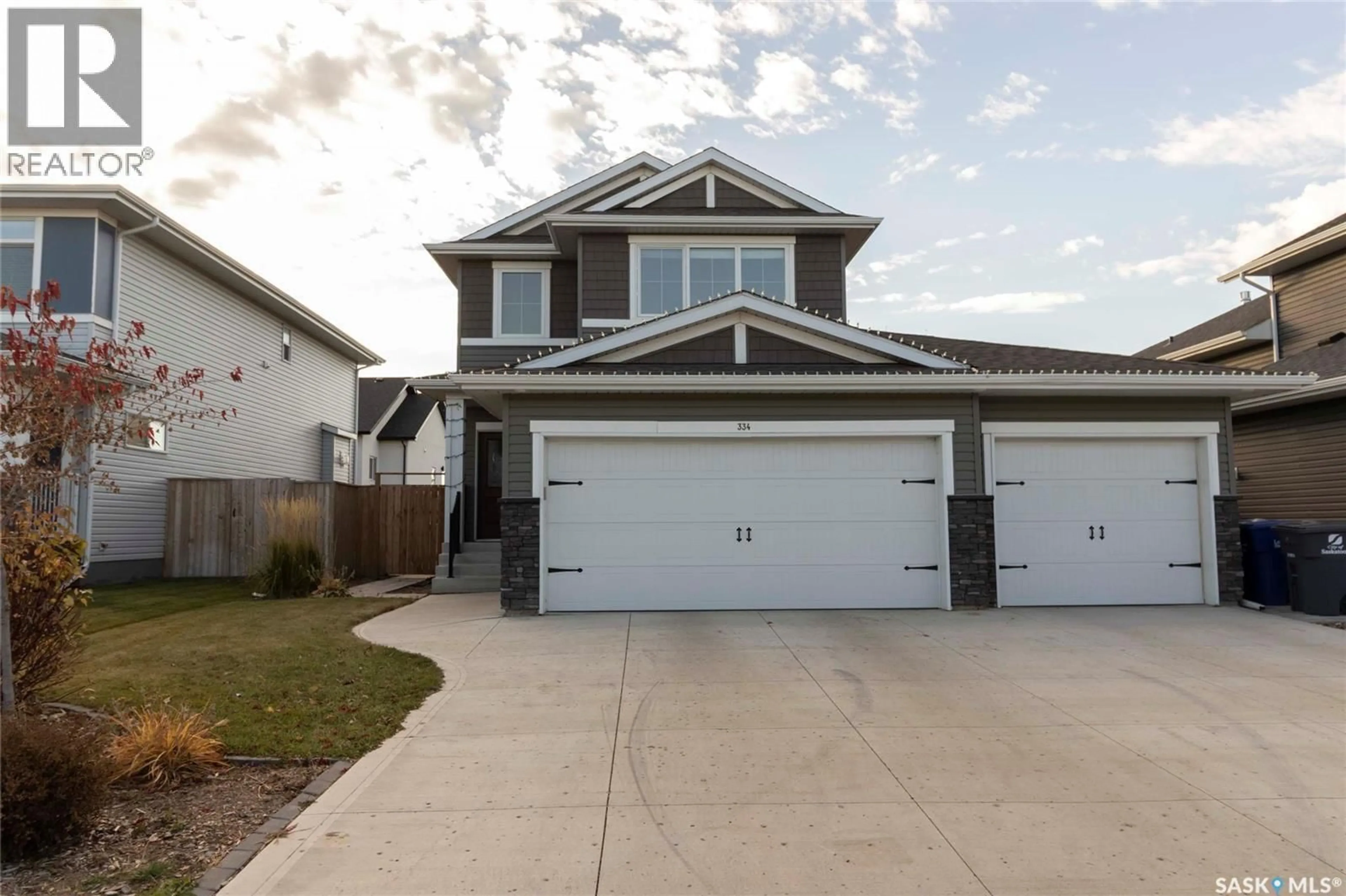 Home with vinyl exterior material, street for 334 HAMM WAY, Saskatoon Saskatchewan S7V0W3