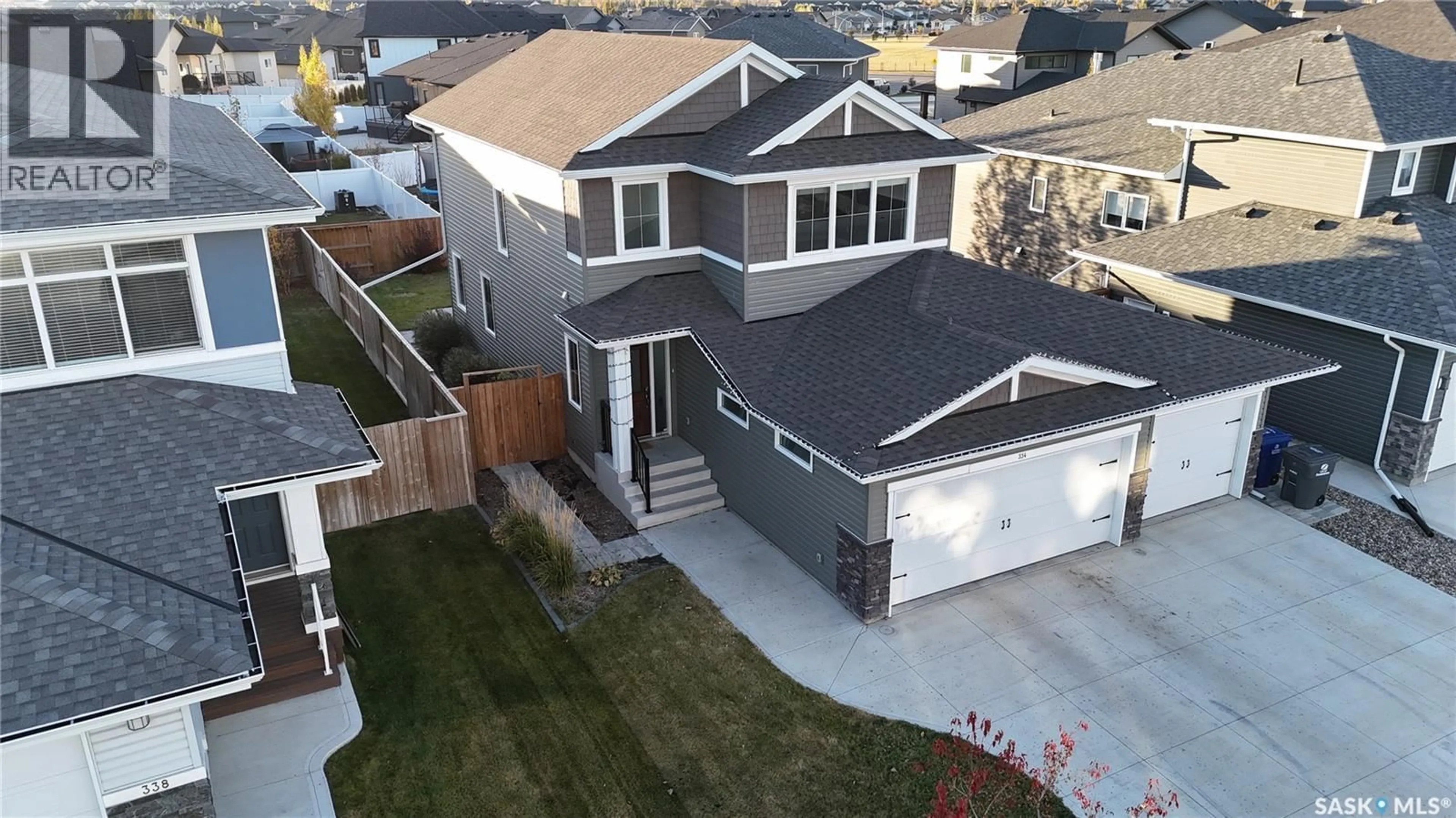 A pic from outside/outdoor area/front of a property/back of a property/a pic from drone, street for 334 HAMM WAY, Saskatoon Saskatchewan S7V0W3