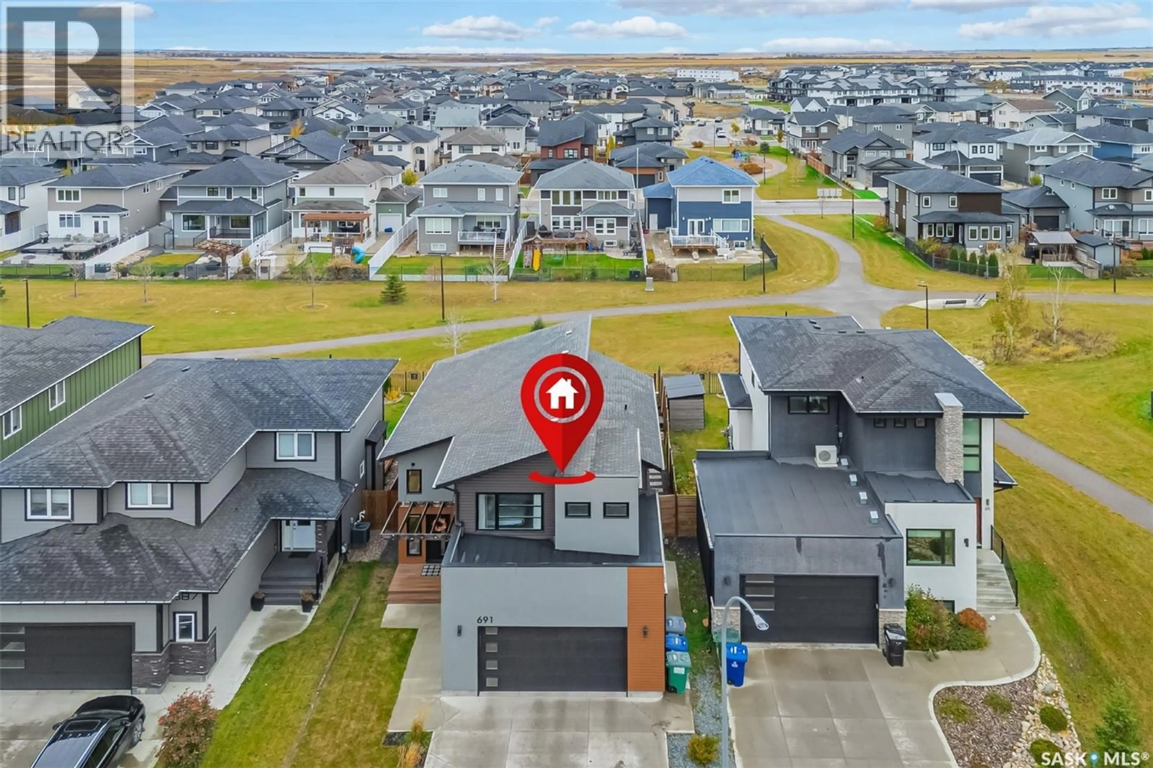 A pic from outside/outdoor area/front of a property/back of a property/a pic from drone, street for 691 FAST CRESCENT, Saskatoon Saskatchewan S7W0X1
