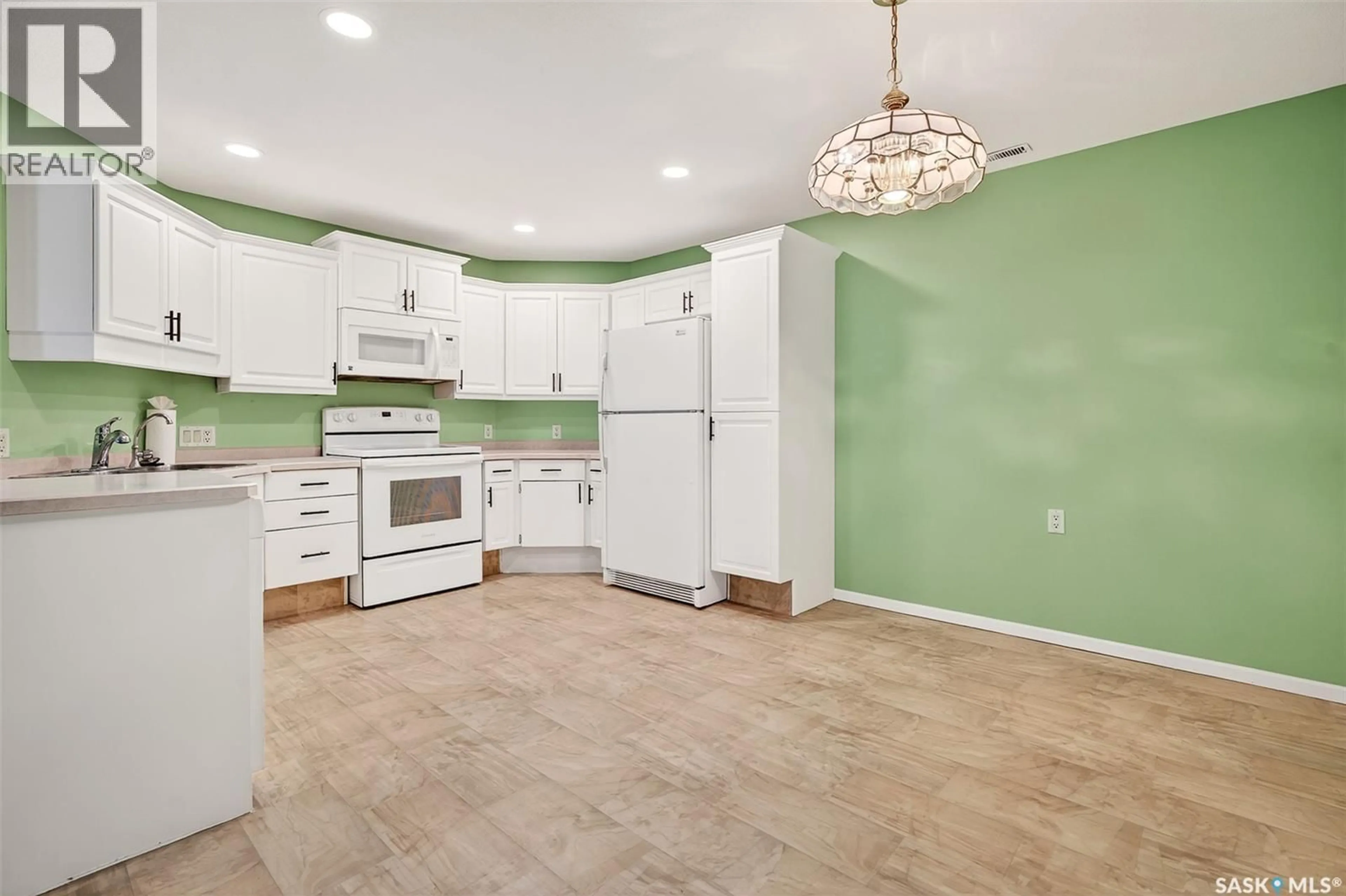 Open concept kitchen, ceramic/tile floor for 105 - 240 ATHABASCA STREET, Moose Jaw Saskatchewan S6H0L5