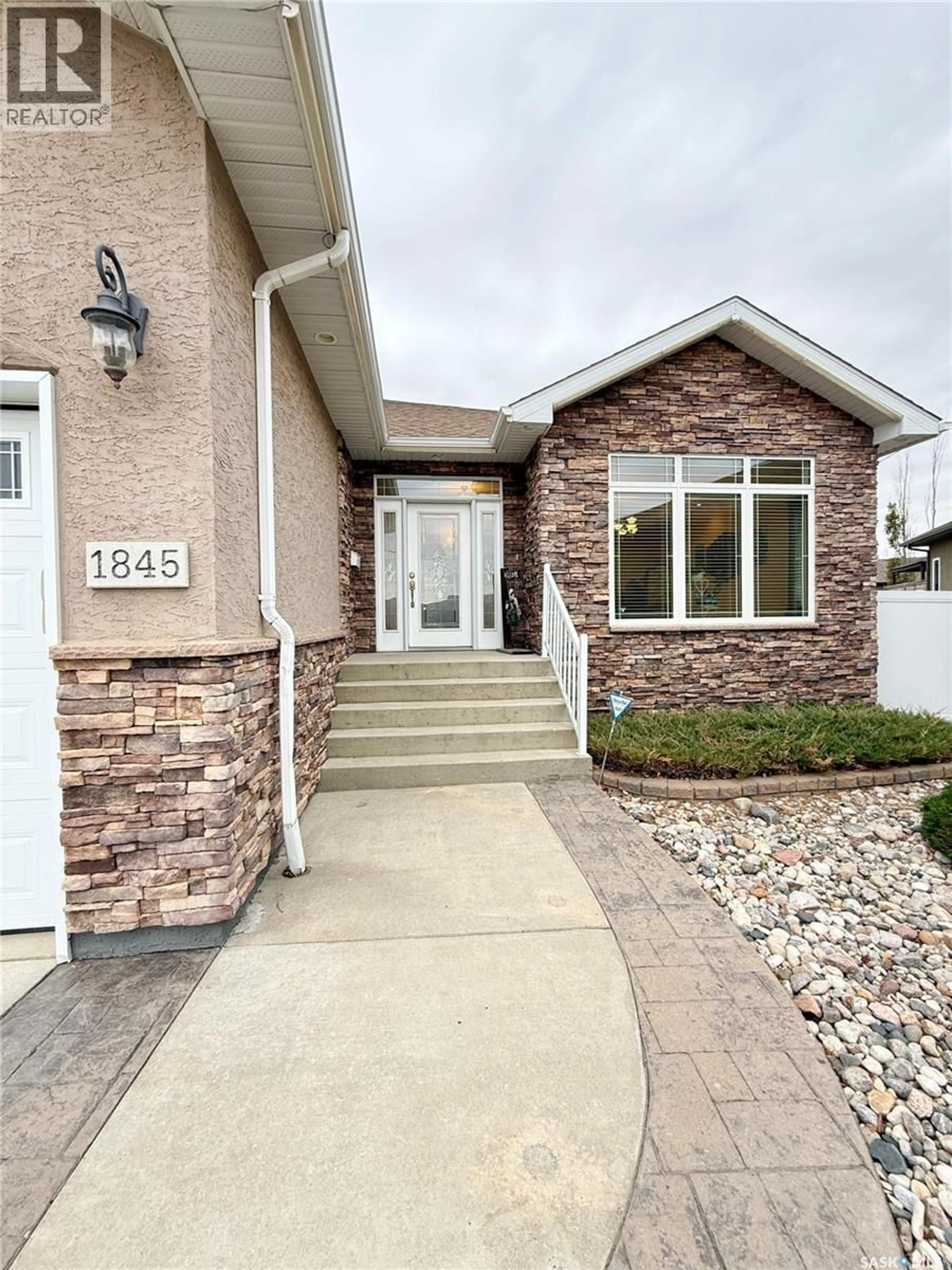 Home with brick exterior material, street for 1845 GORDON MILES PLACE, Weyburn Saskatchewan S4H0B9
