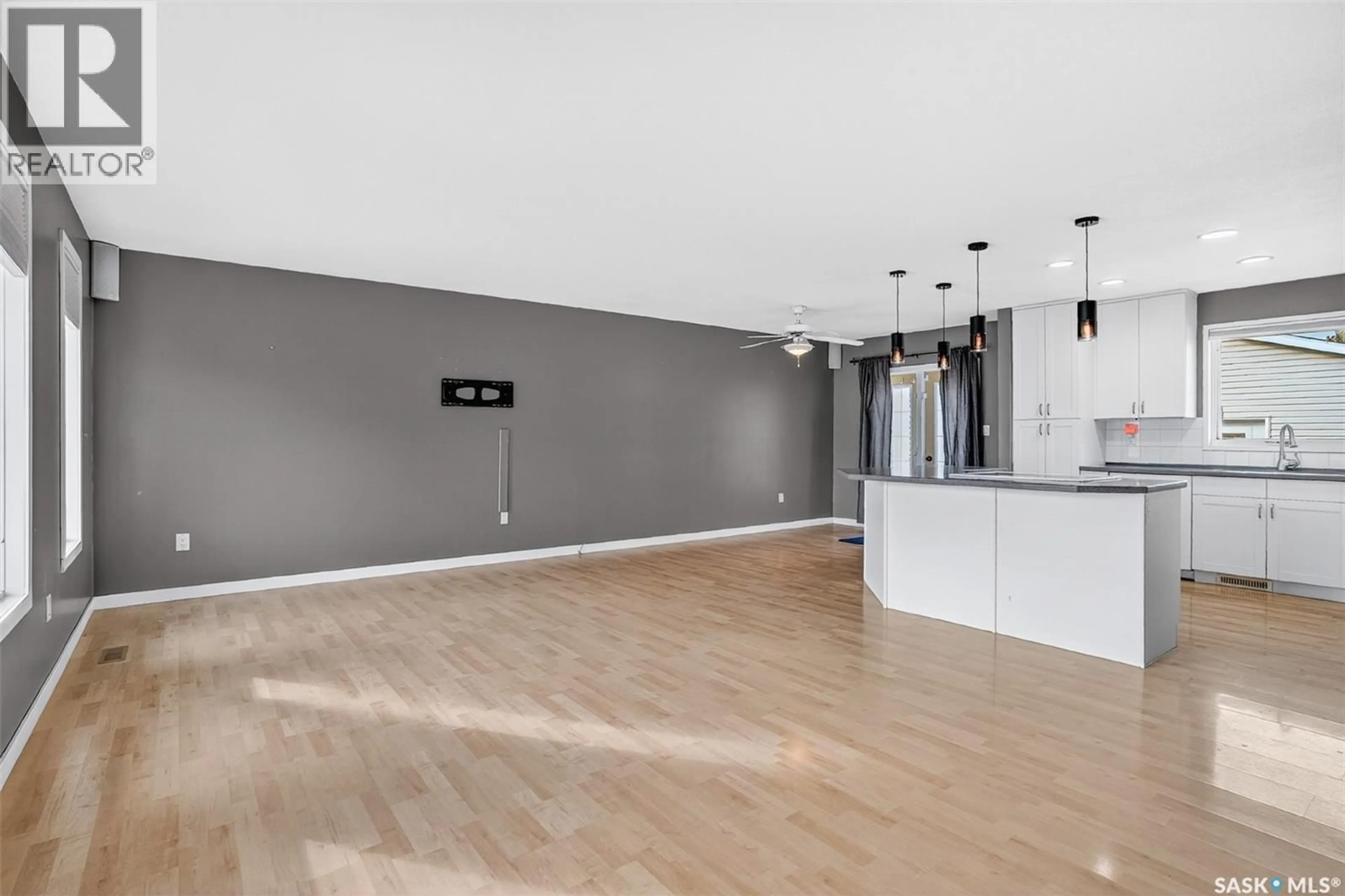 Open concept kitchen, wood/laminate floor for 131 ARRAND CRESCENT, Saskatoon Saskatchewan S7M5A3