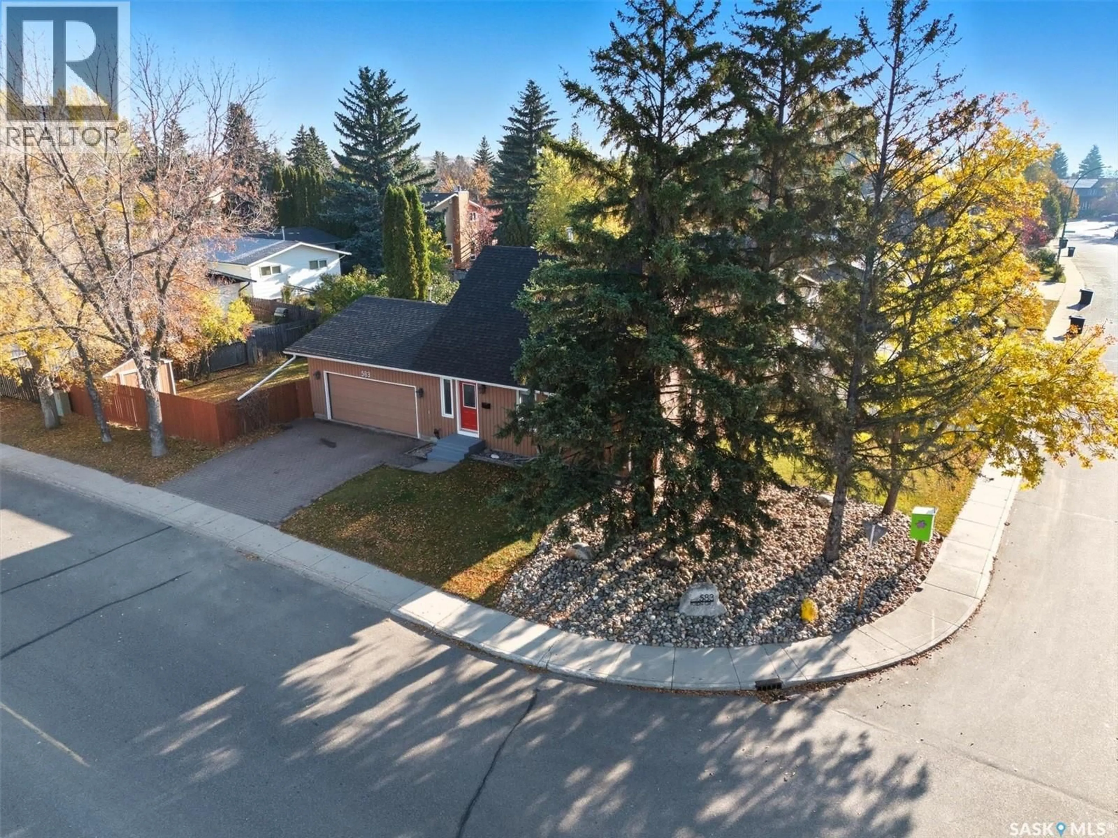 A pic from outside/outdoor area/front of a property/back of a property/a pic from drone, street for 583 TOBIN CRESCENT, Saskatoon Saskatchewan S7K4N9