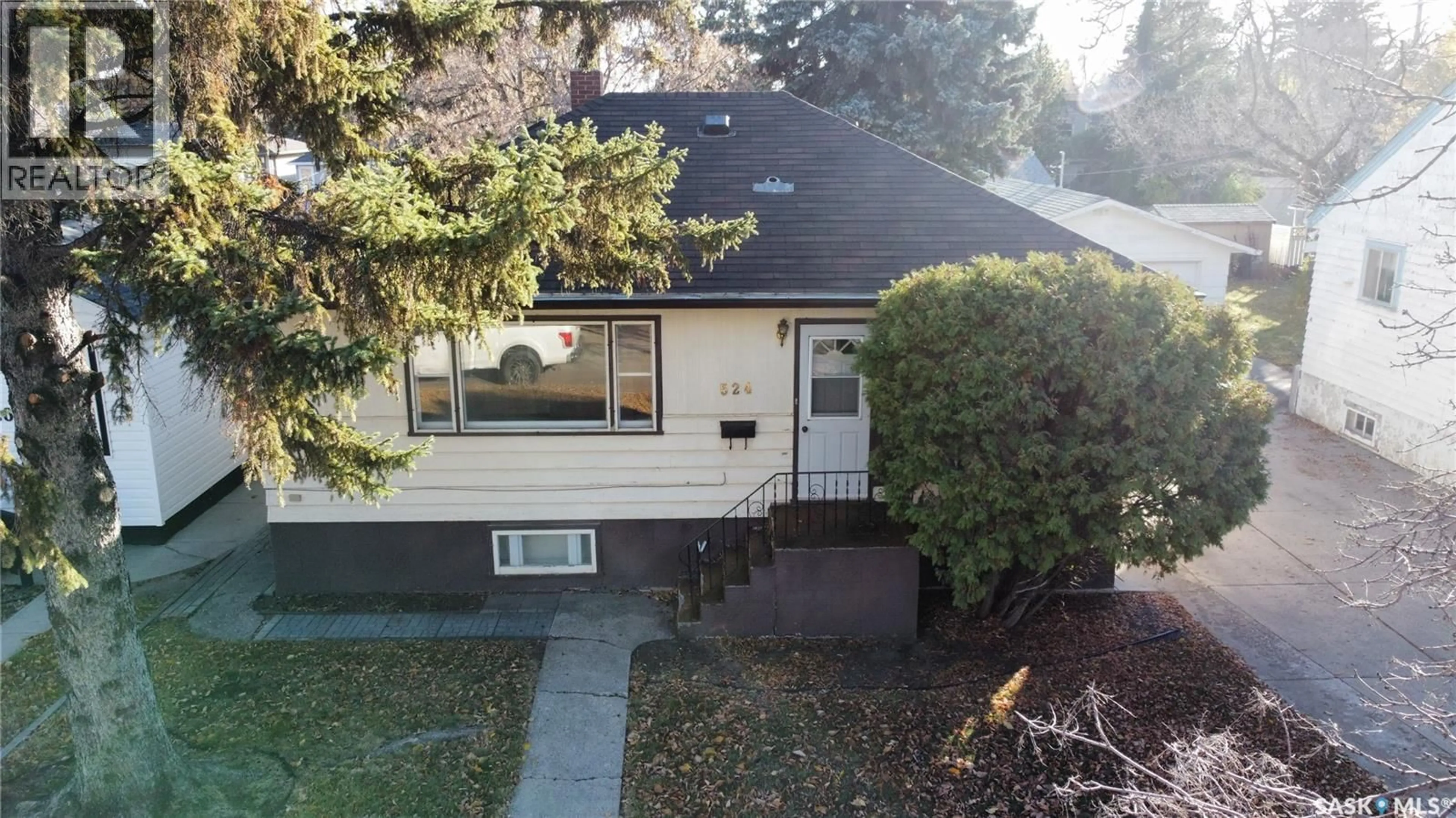 Home with vinyl exterior material, street for 524 1ST STREET, Saskatoon Saskatchewan S7H1S6