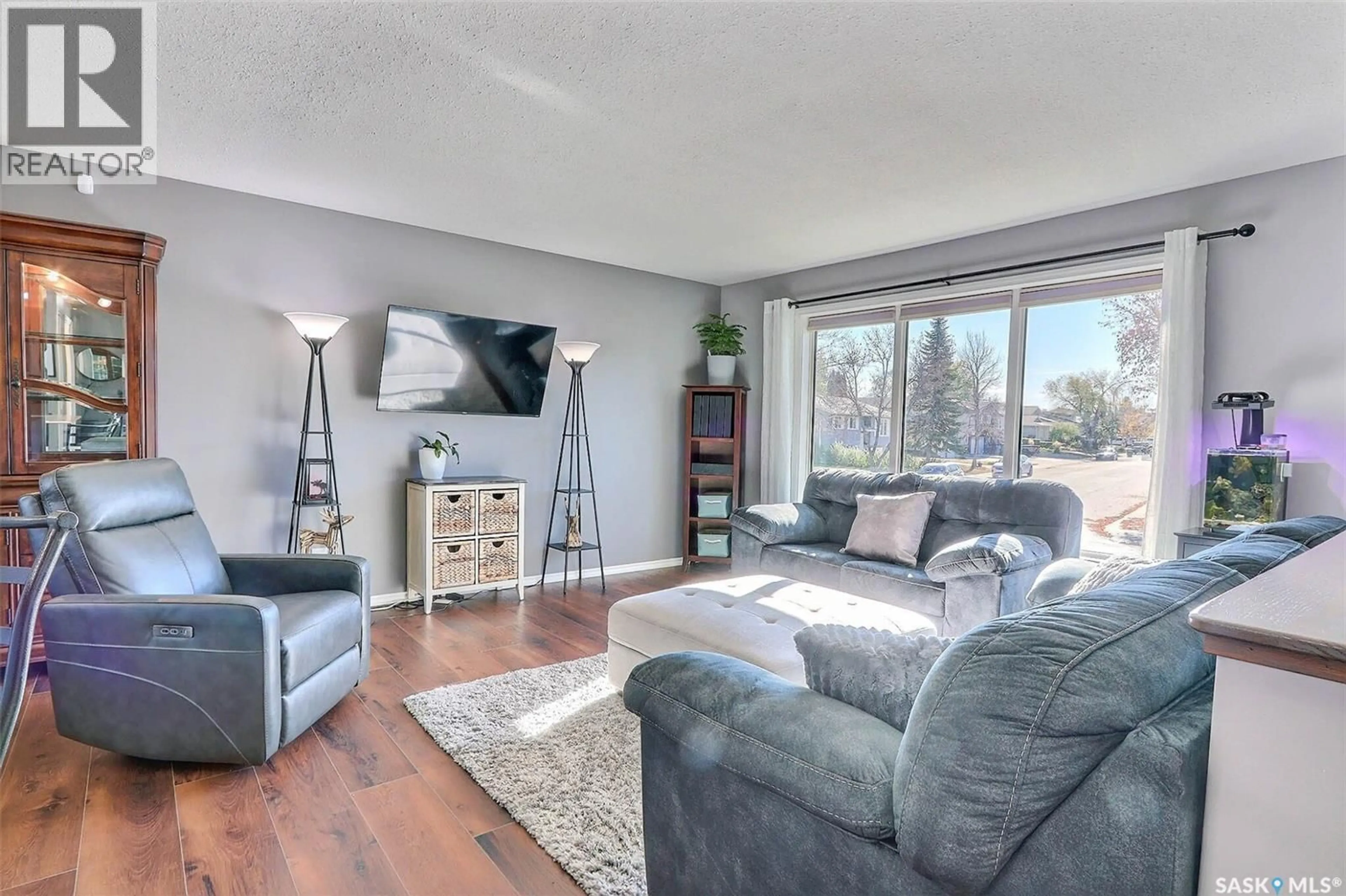 Living room with furniture, wood/laminate floor for 1520 BLISS CRESCENT, Prince Albert Saskatchewan S6V7W7