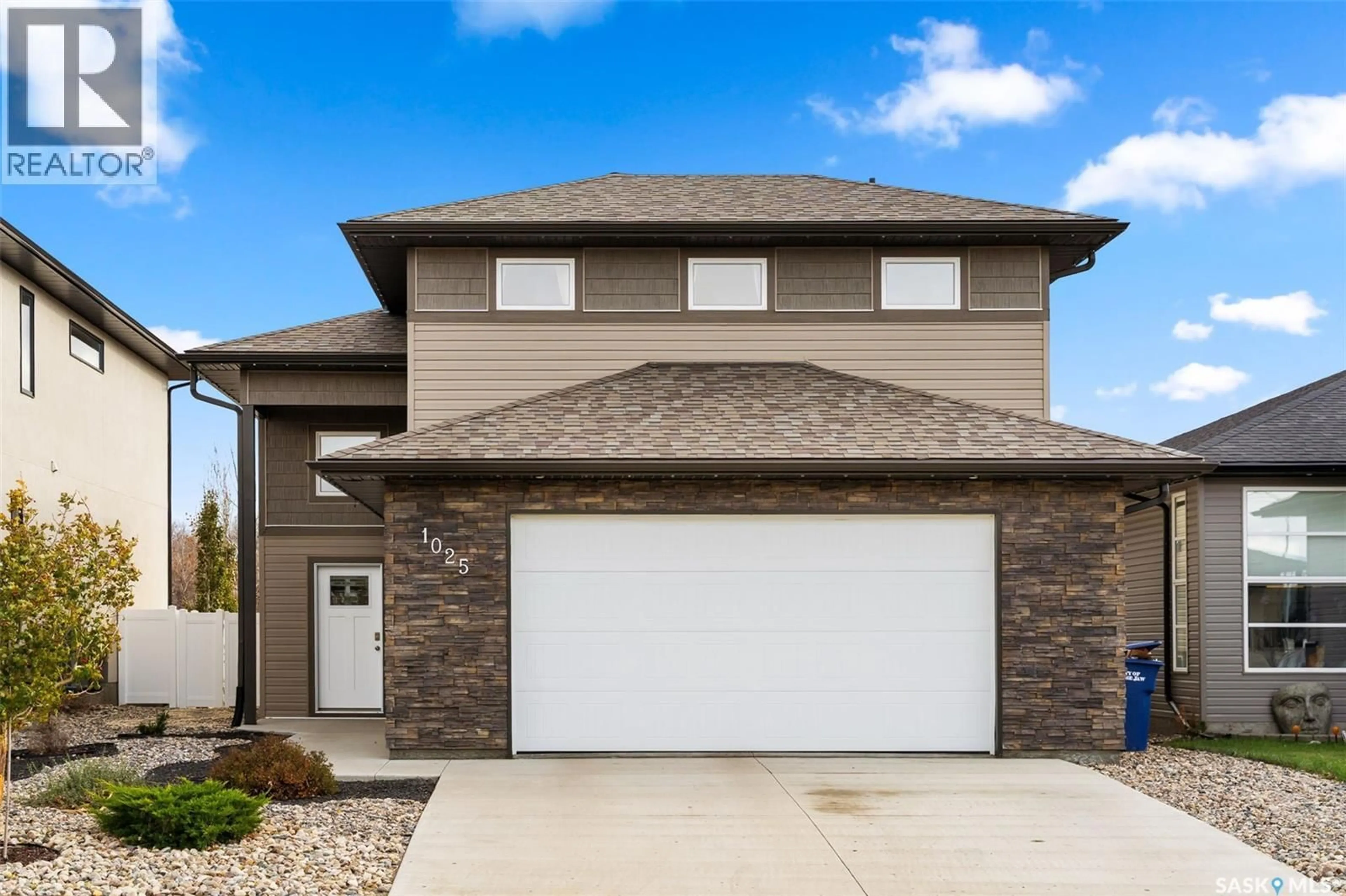 Home with brick exterior material, street for 1025 MAPLEWOOD DRIVE, Moose Jaw Saskatchewan S6J0E4