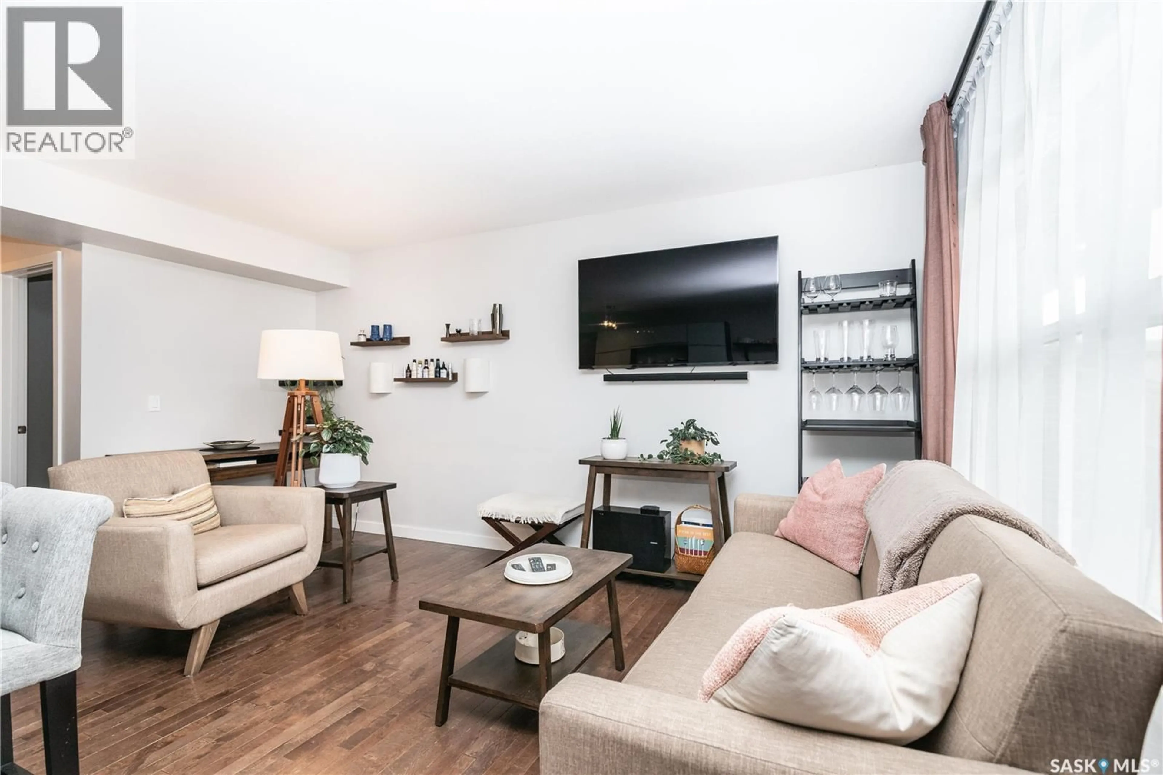 Living room with furniture, wood/laminate floor for 603 455 REMPEL LANE, Saskatoon Saskatchewan S7T0R8