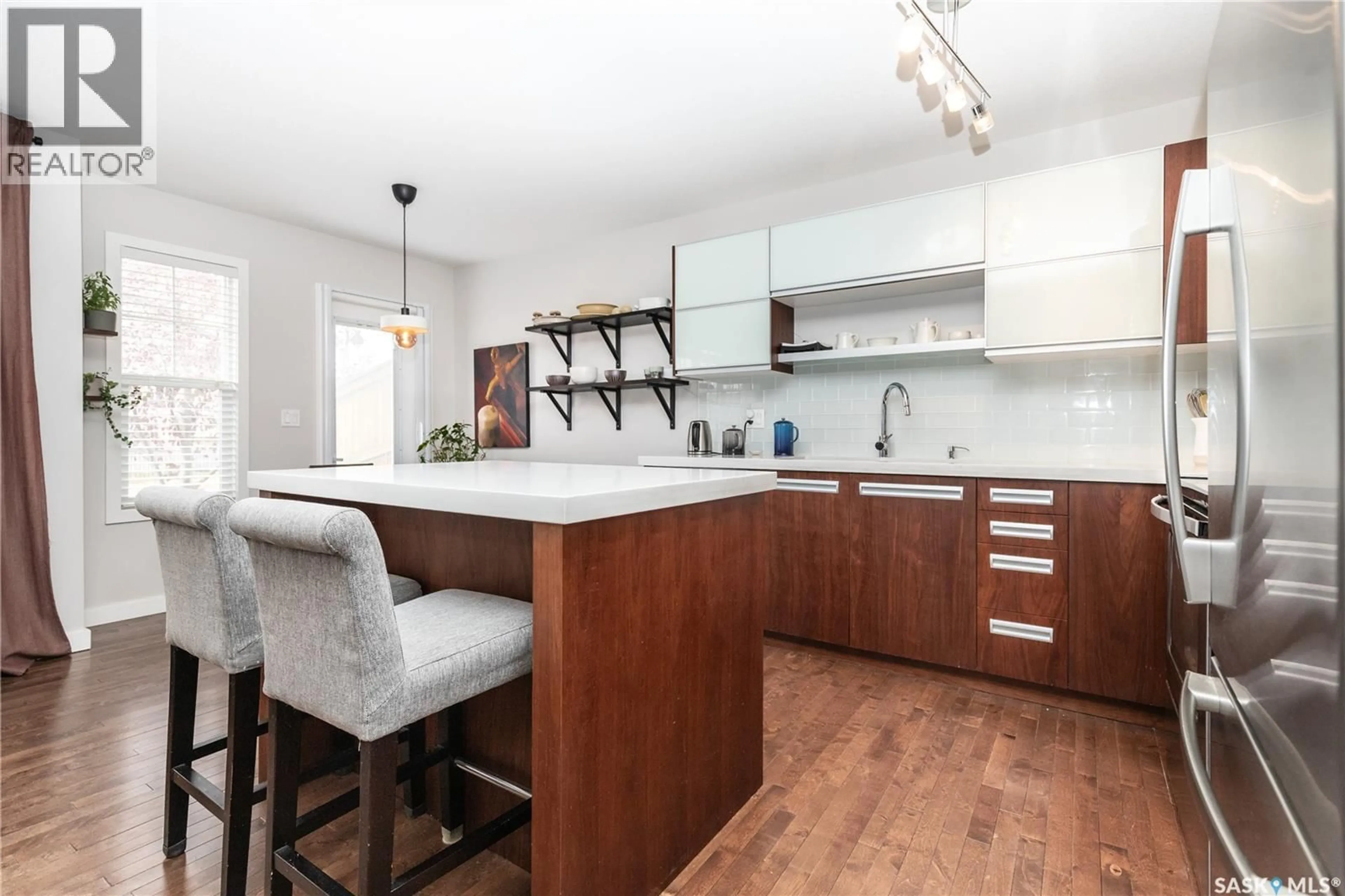 Open concept kitchen, wood/laminate floor for 603 455 REMPEL LANE, Saskatoon Saskatchewan S7T0R8