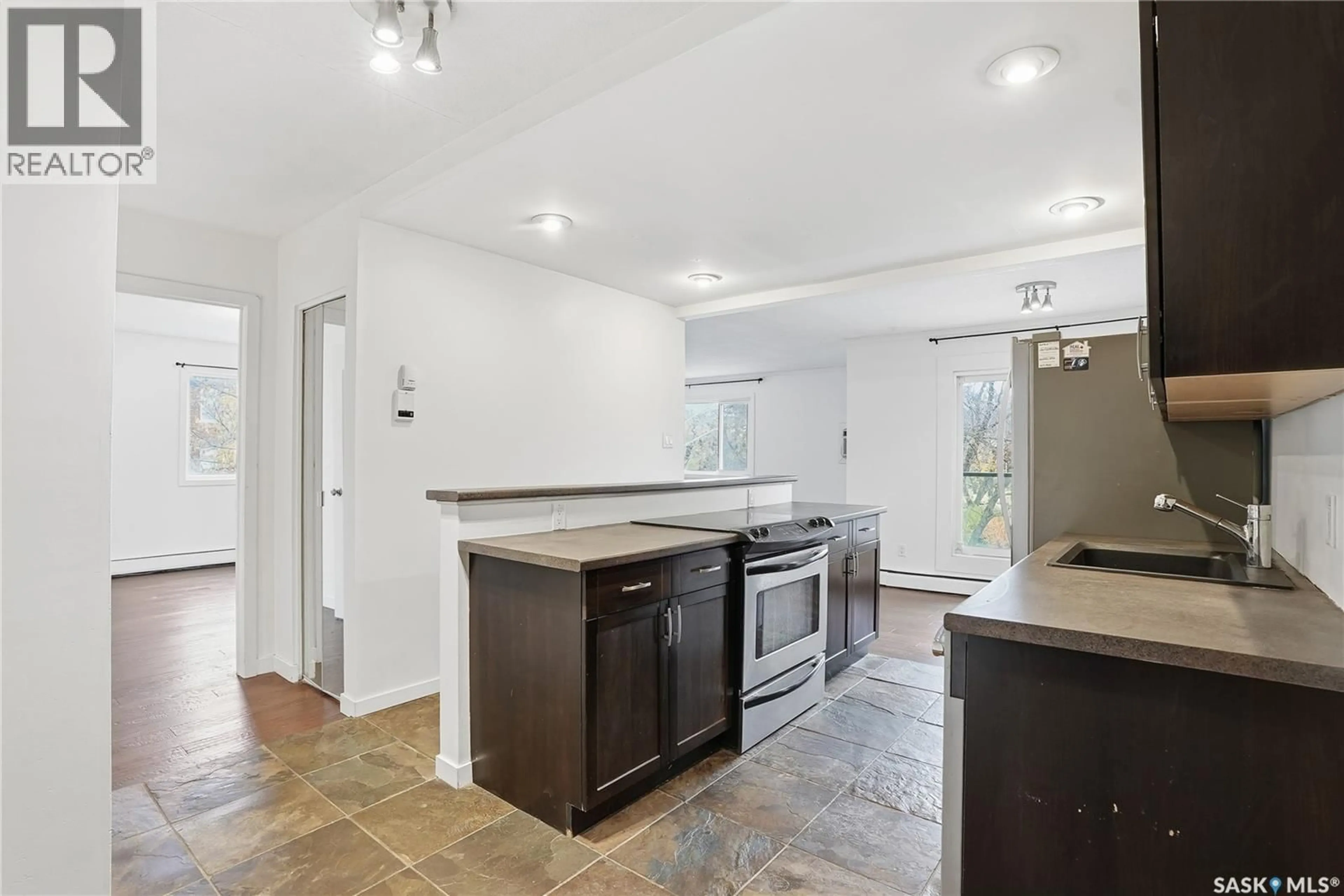 Open concept kitchen, ceramic/tile floor for N - 13 833 B AVENUE, Saskatoon Saskatchewan S7L1E5