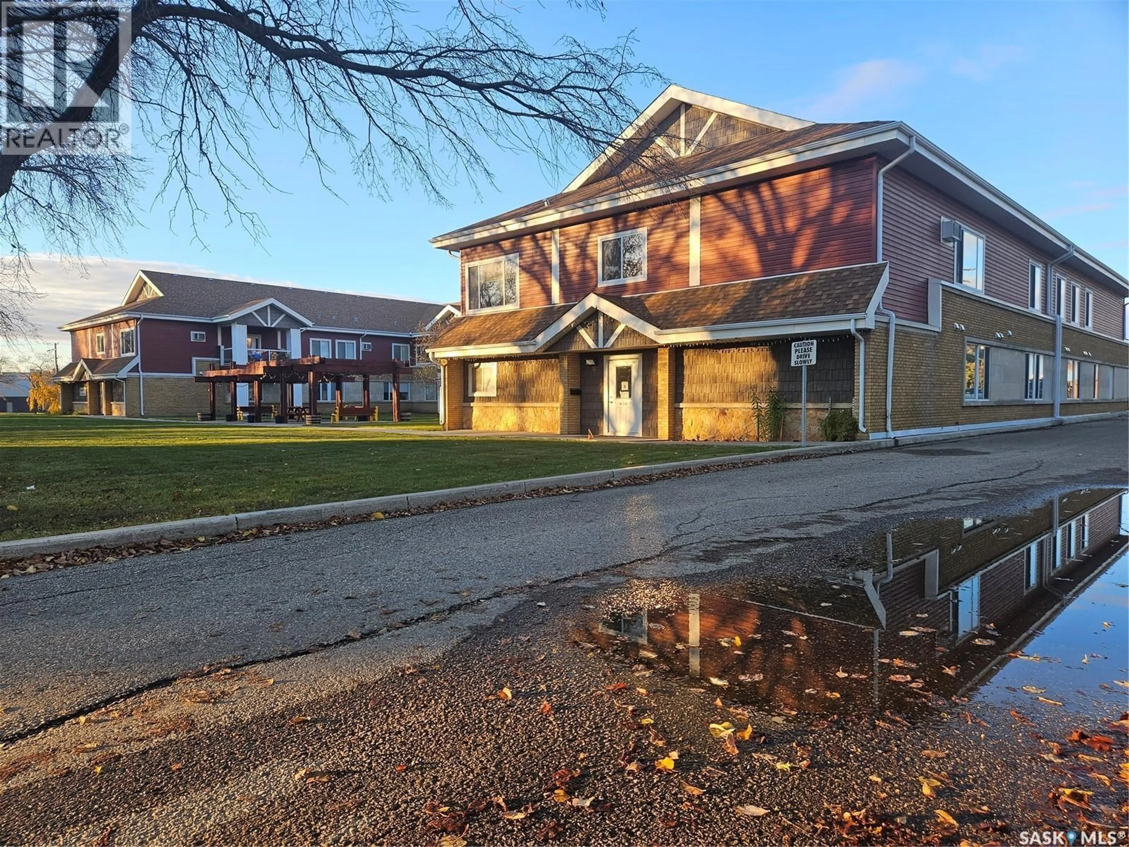 A pic from outside/outdoor area/front of a property/back of a property/a pic from drone, street for 302 - 105 BEMISTER AVENUE E, Melfort Saskatchewan S0E1A0