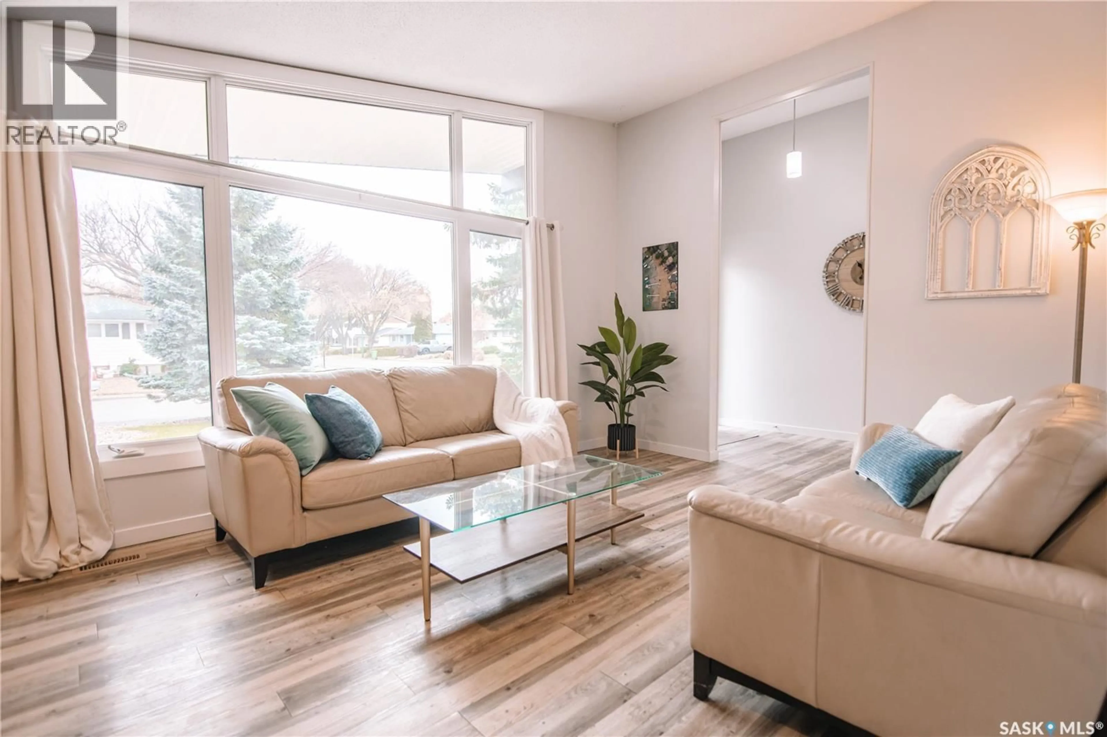 Living room with furniture, wood/laminate floor for 4180 PRINCESS STREET, Regina Saskatchewan S4S3N3