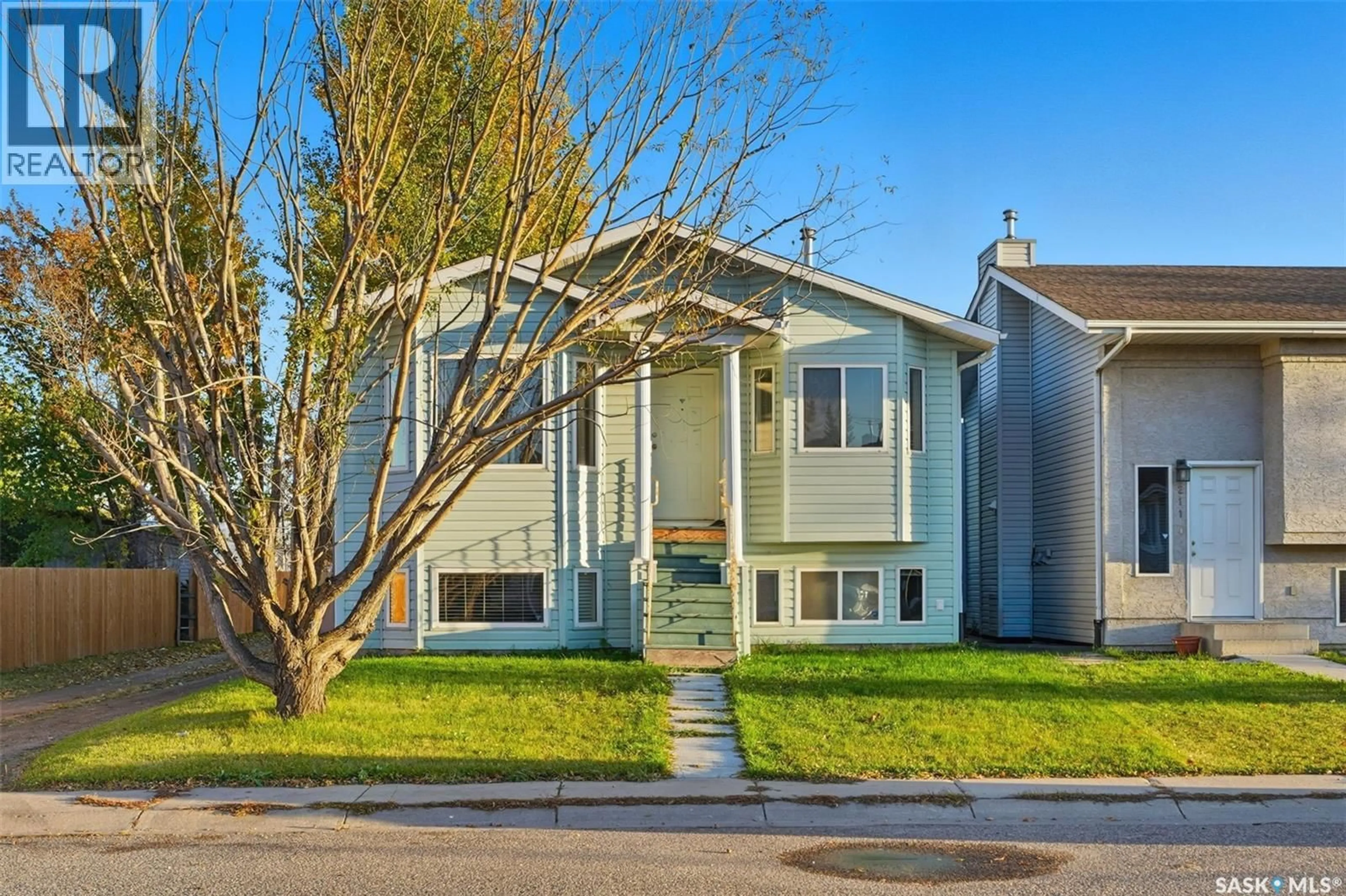 Home with vinyl exterior material, street for 213 HEDLEY STREET, Saskatoon Saskatchewan S7N1Z9