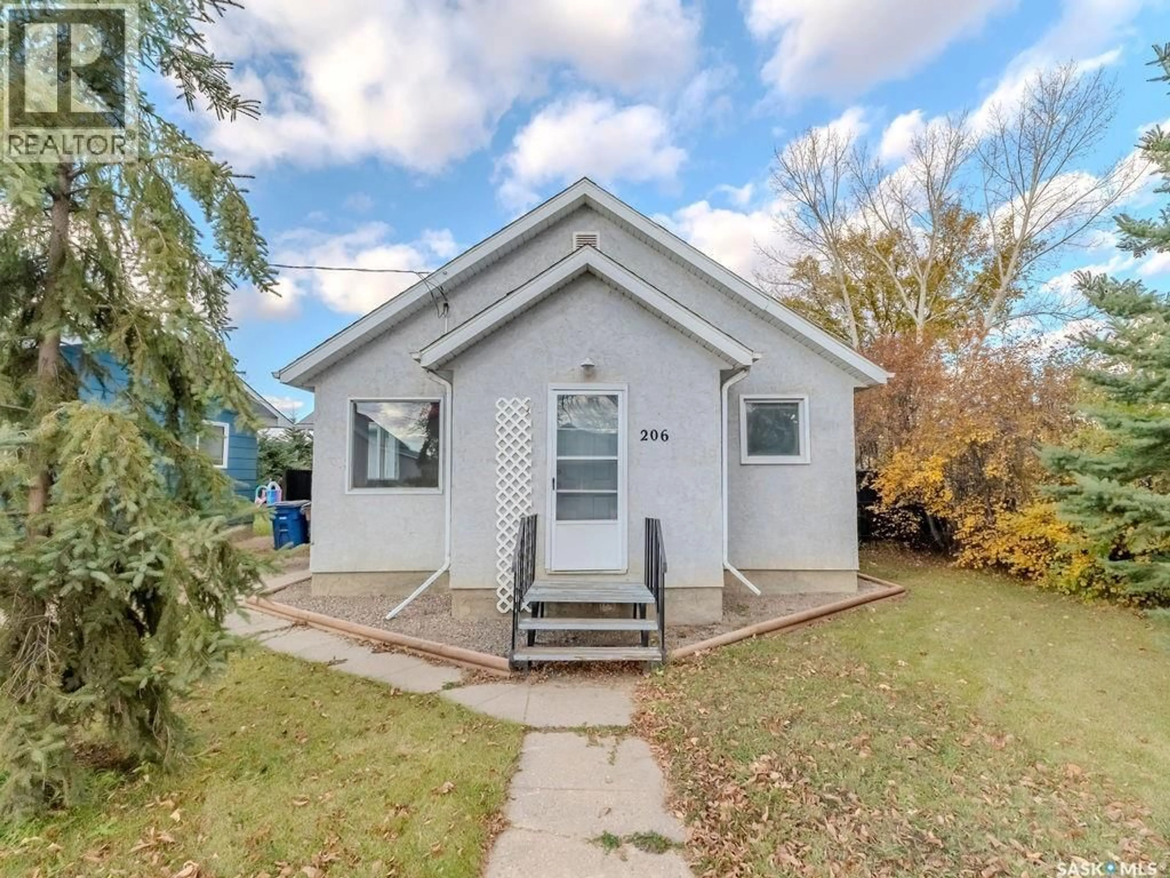 Home with vinyl exterior material, street for 206 1ST STREET, Domremy Saskatchewan S0K1G0