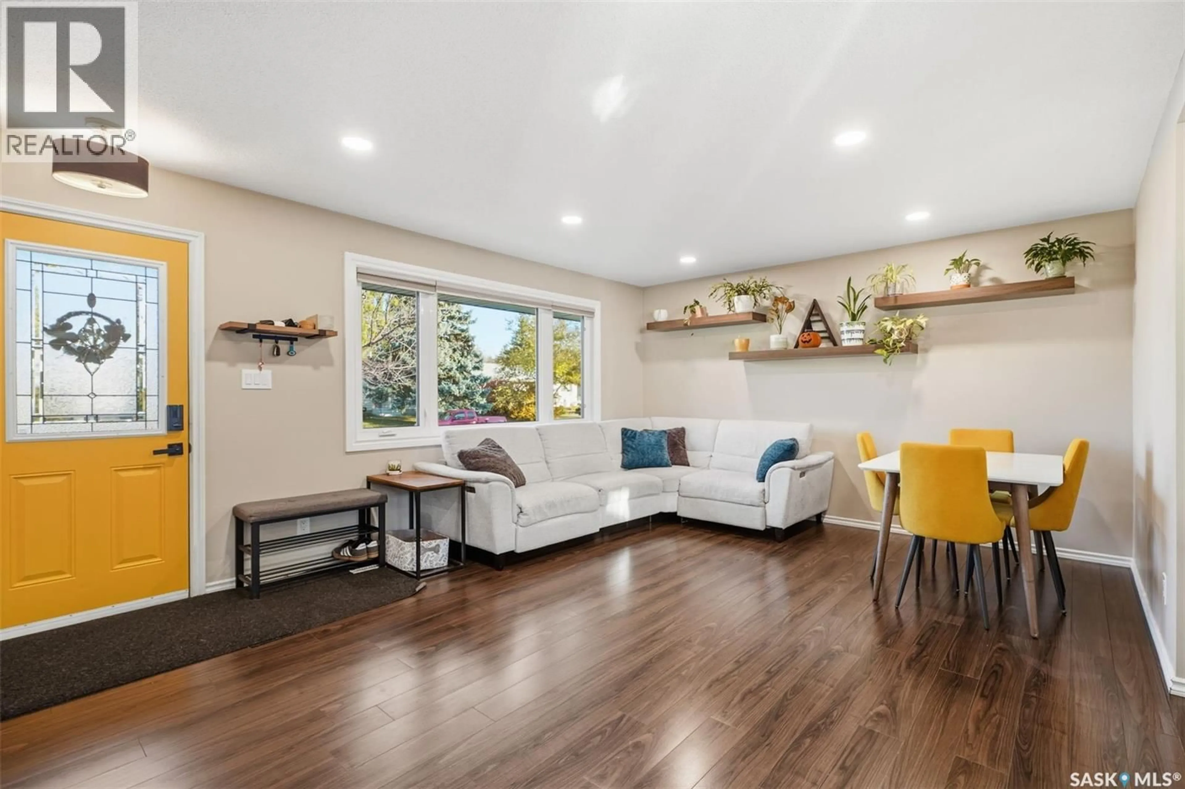Living room with furniture, wood/laminate floor for 22 MIDDLETON CRESCENT, Saskatoon Saskatchewan S7J2W4