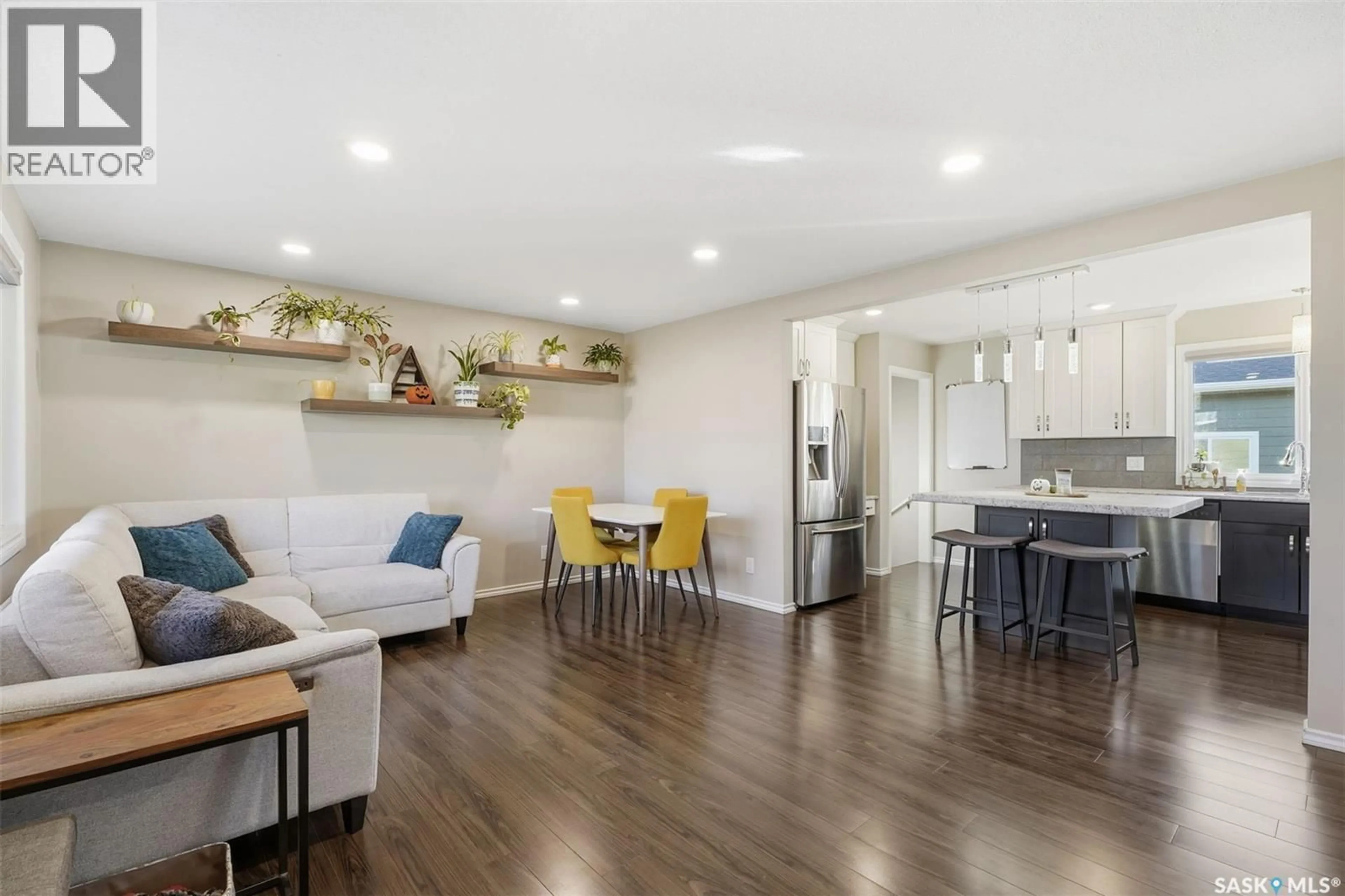 Open concept kitchen, wood/laminate floor for 22 MIDDLETON CRESCENT, Saskatoon Saskatchewan S7J2W4