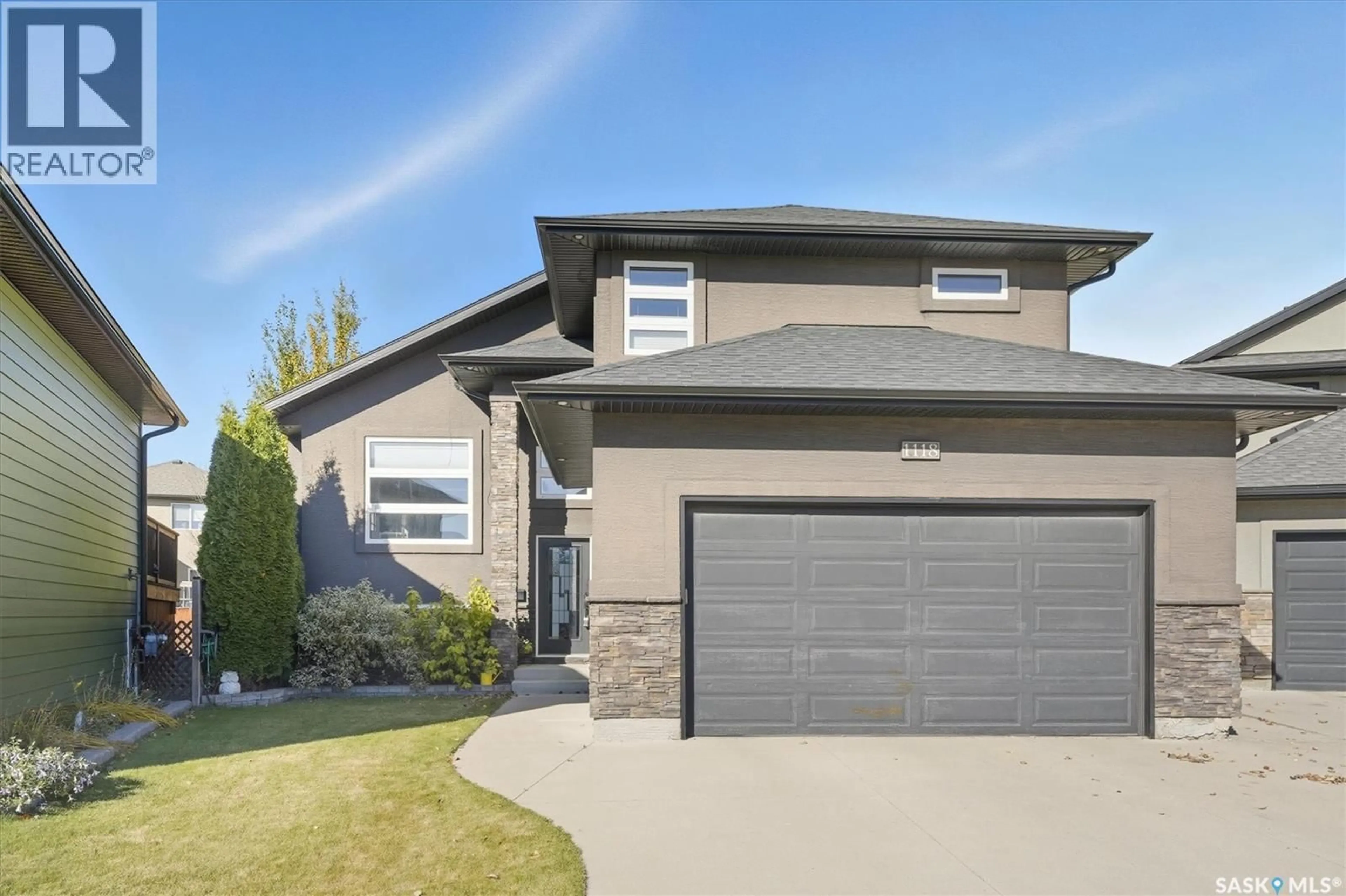 Home with vinyl exterior material, street for 1118 REMPEL PLACE, Saskatoon Saskatchewan S7T0M2
