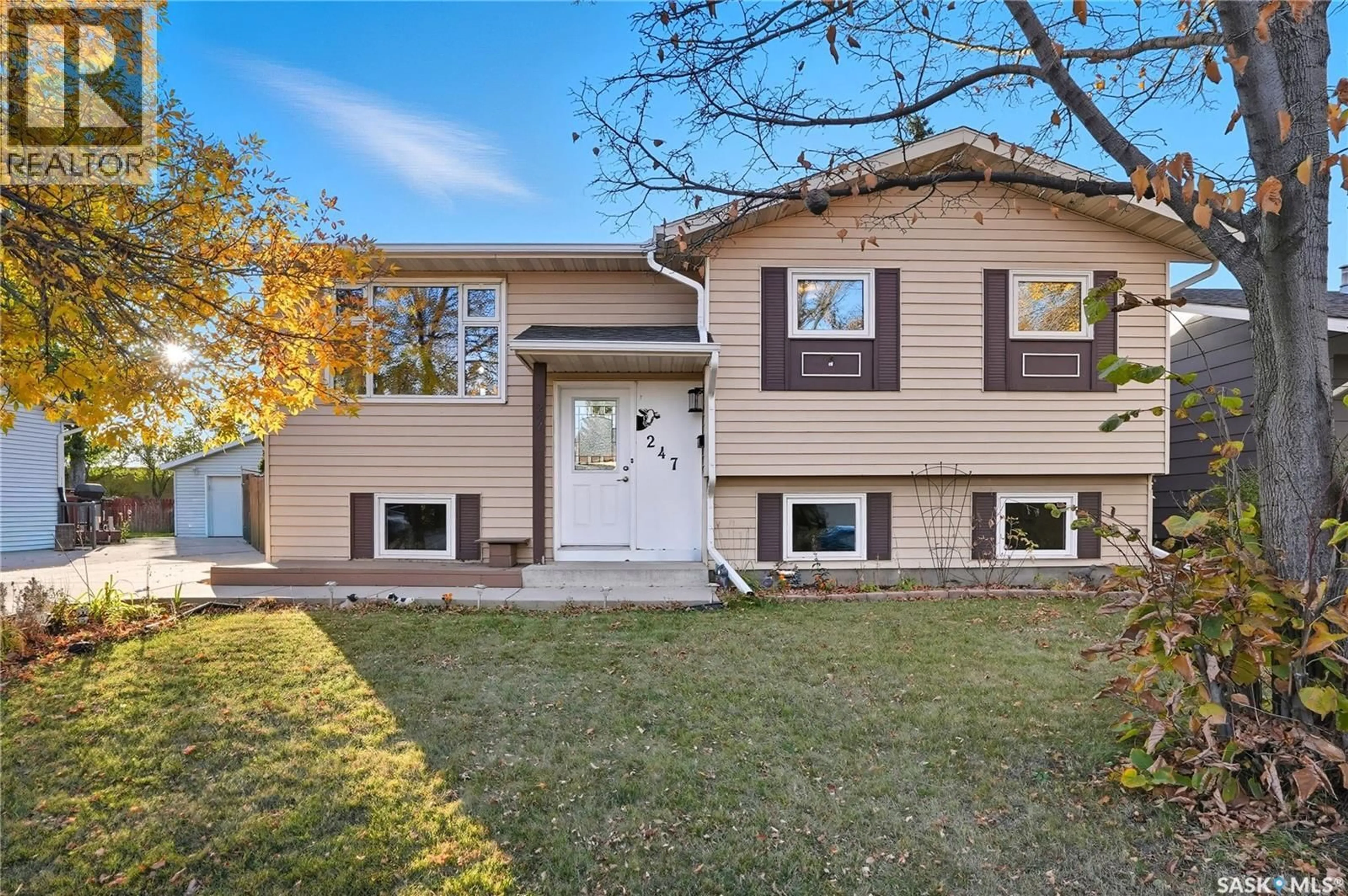 Home with vinyl exterior material, street for 247 DAVIES ROAD, Saskatoon Saskatchewan S7K7N2