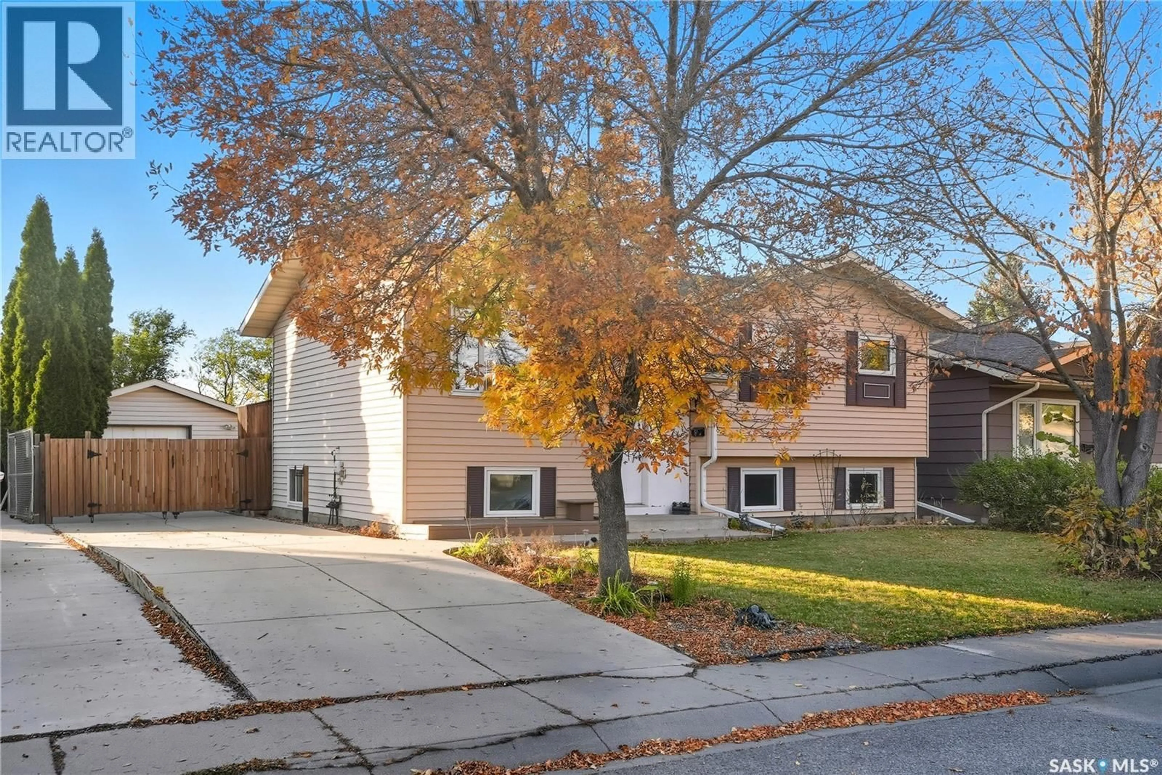Home with brick exterior material, street for 247 DAVIES ROAD, Saskatoon Saskatchewan S7K7N2