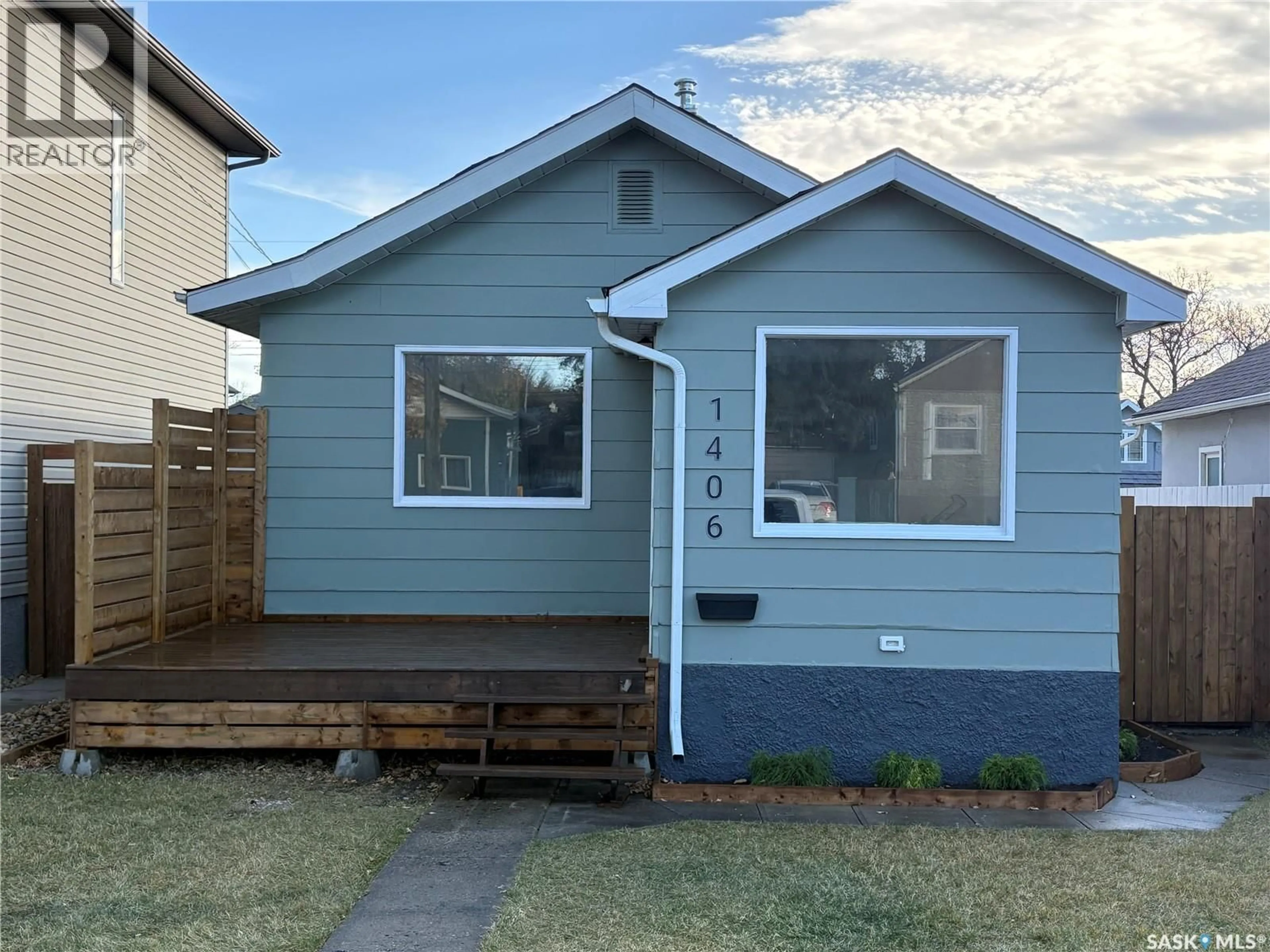 Home with vinyl exterior material, street for 1406 6TH AVENUE, Saskatoon Saskatchewan S7K2T8