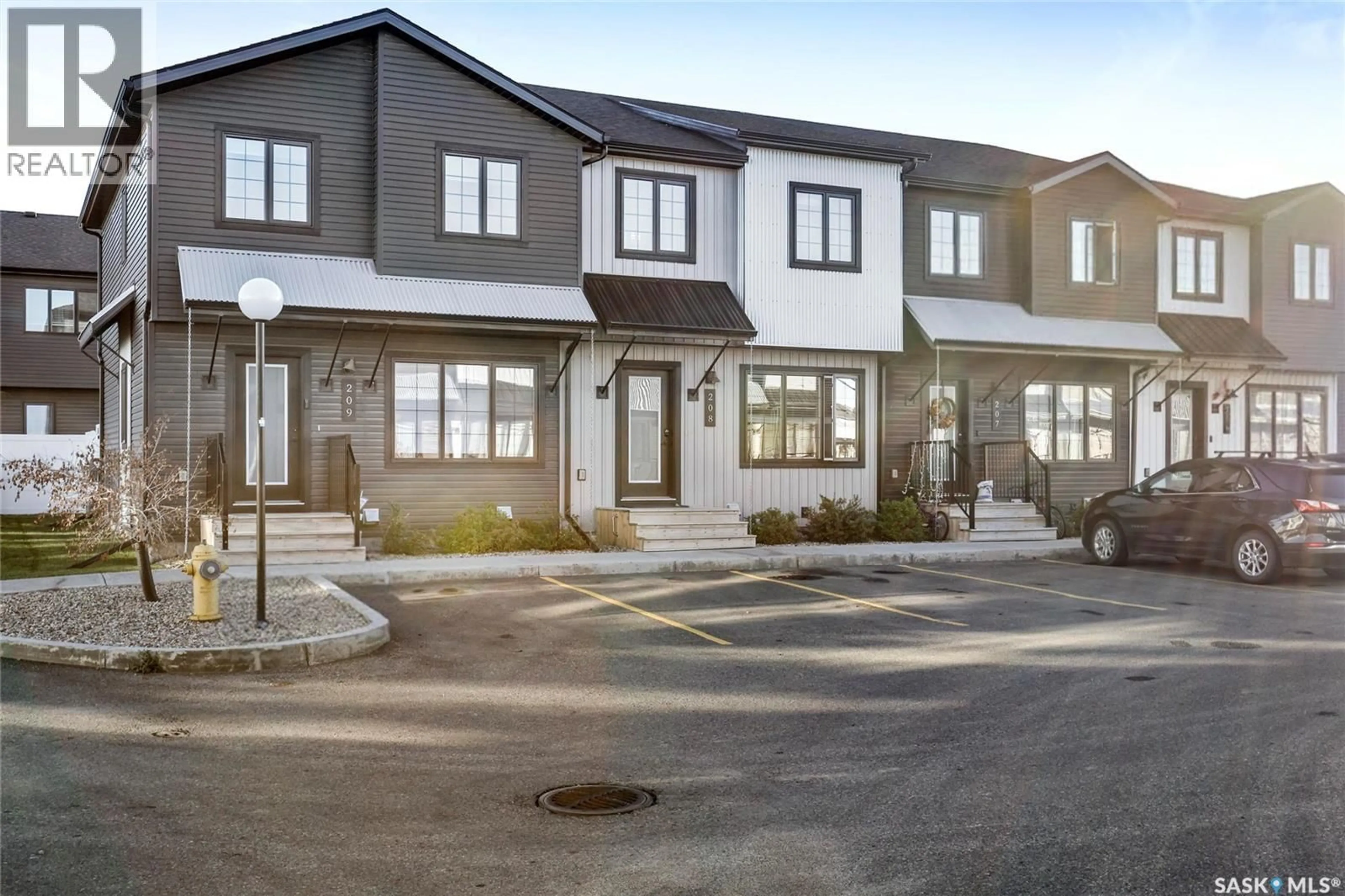 Home with vinyl exterior material, street for 208 - 2715 NARCISSE DRIVE, Regina Saskatchewan S4X0P8