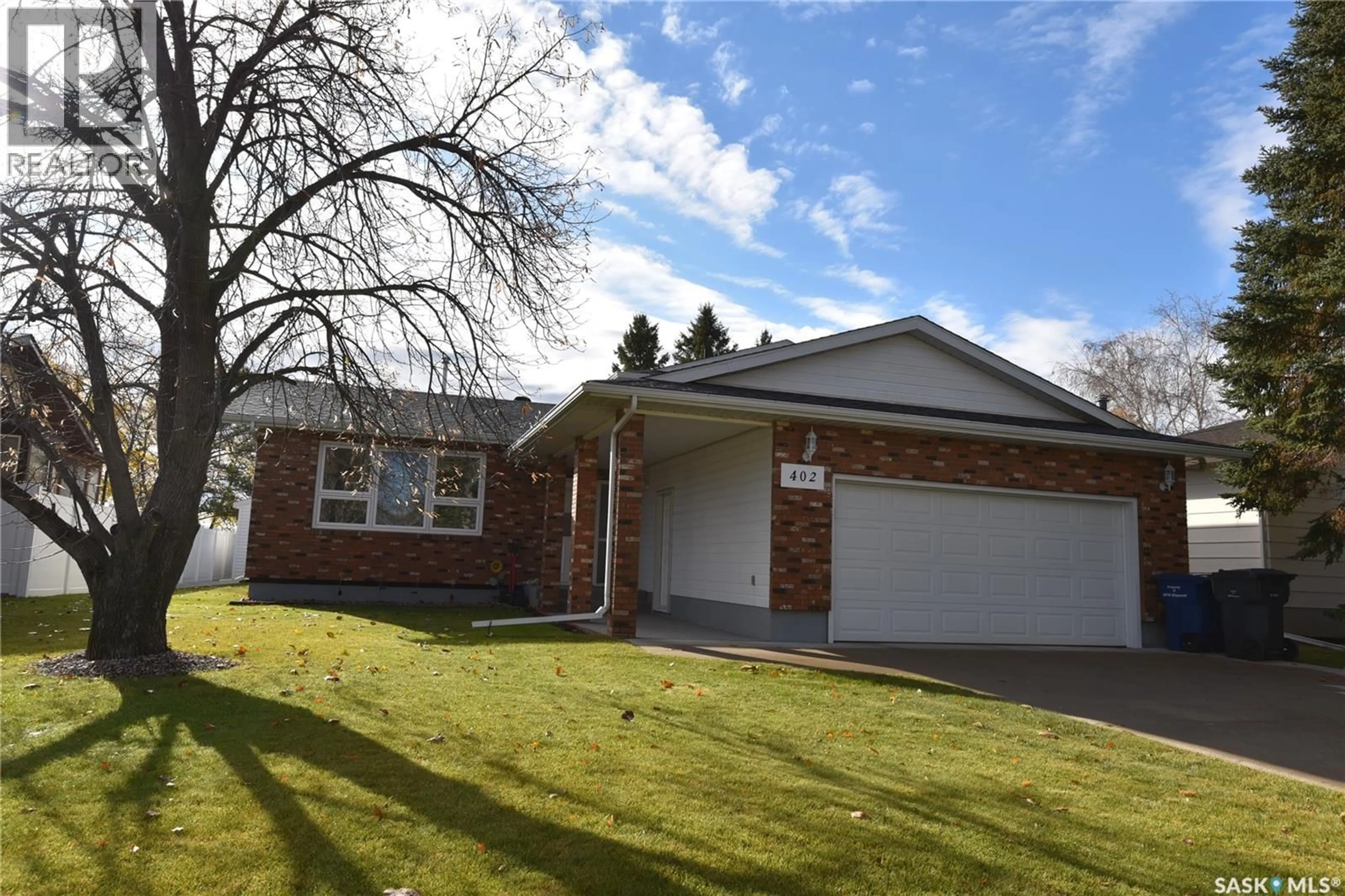 Home with brick exterior material, street for 402 WATSON CRESCENT, Nipawin Saskatchewan S0E1E0