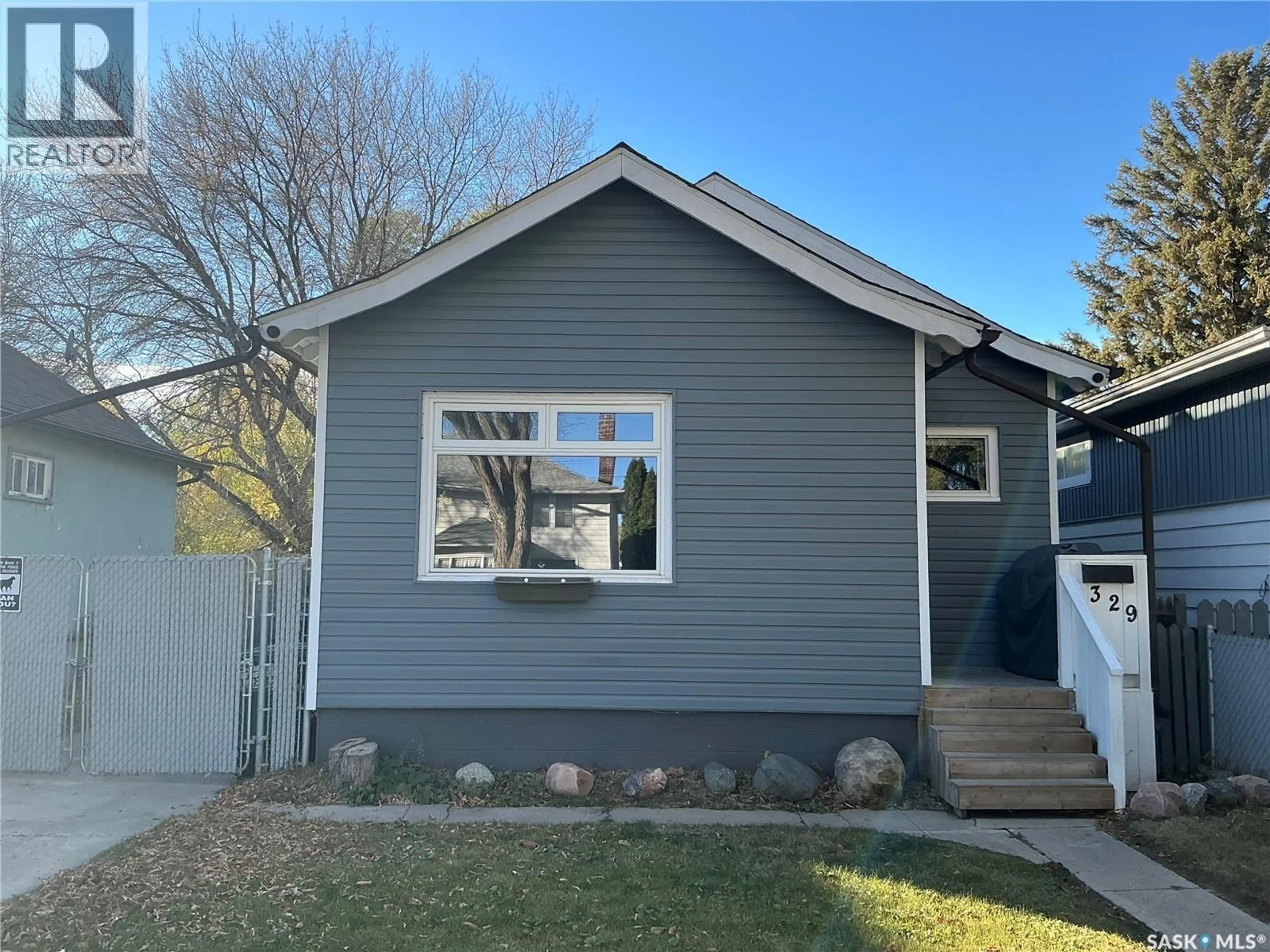Home with vinyl exterior material, street for 329 I AVENUE, Saskatoon Saskatchewan S7M1Y1