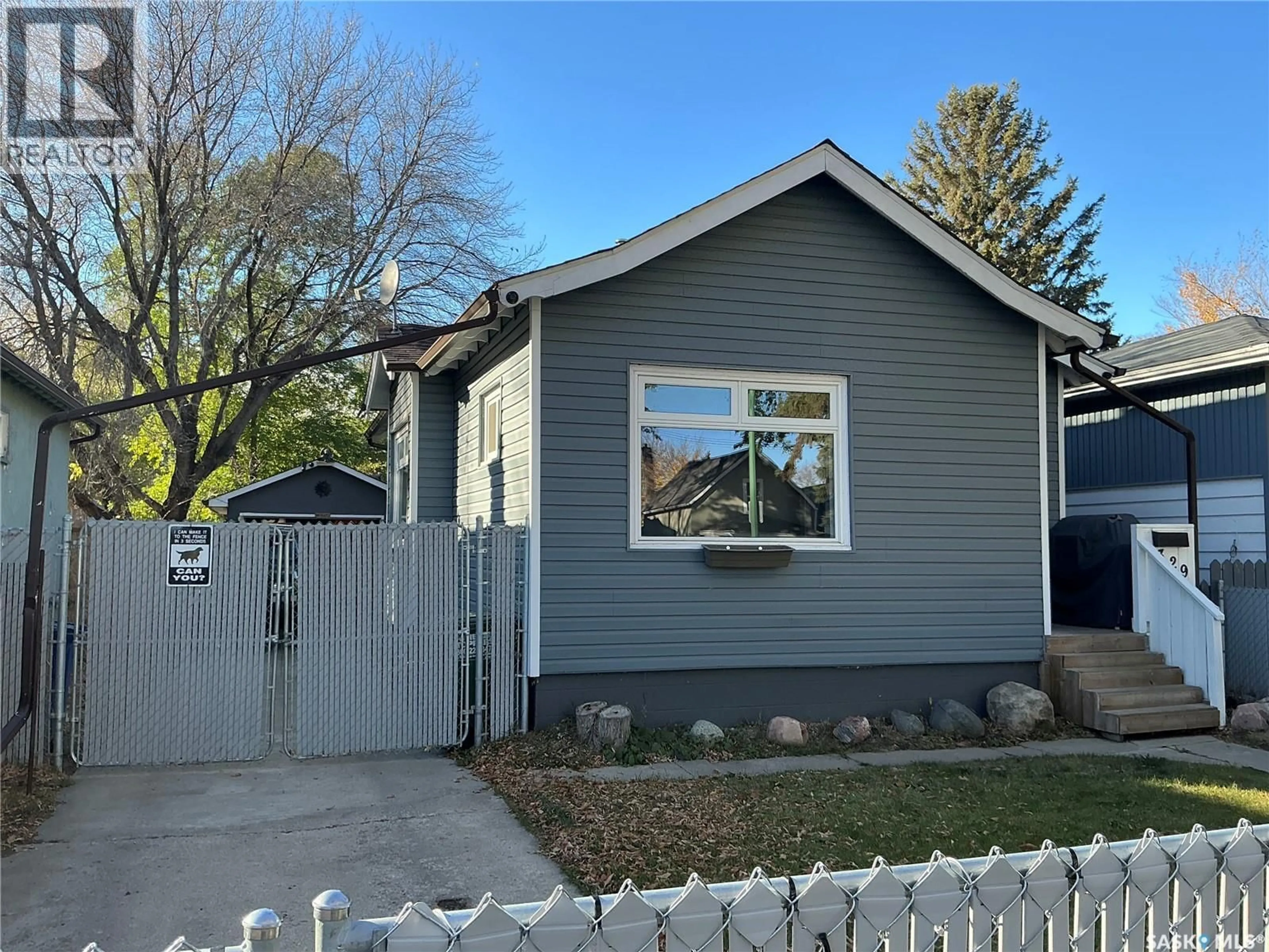 Home with vinyl exterior material, street for 329 I AVENUE, Saskatoon Saskatchewan S7M1Y1
