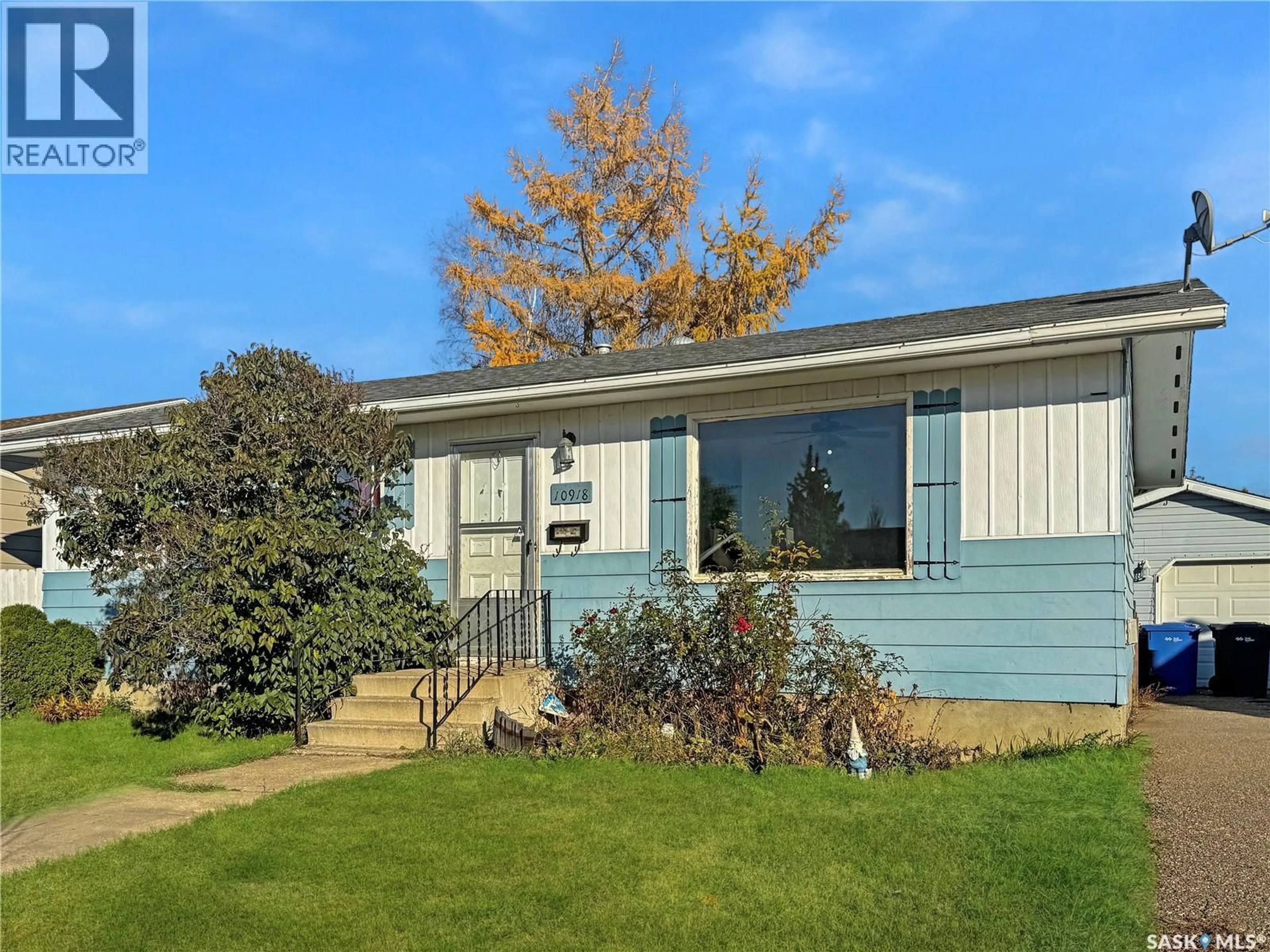 Home with vinyl exterior material, street for 10918 SCOTT DRIVE, North Battleford Saskatchewan S9A3L9
